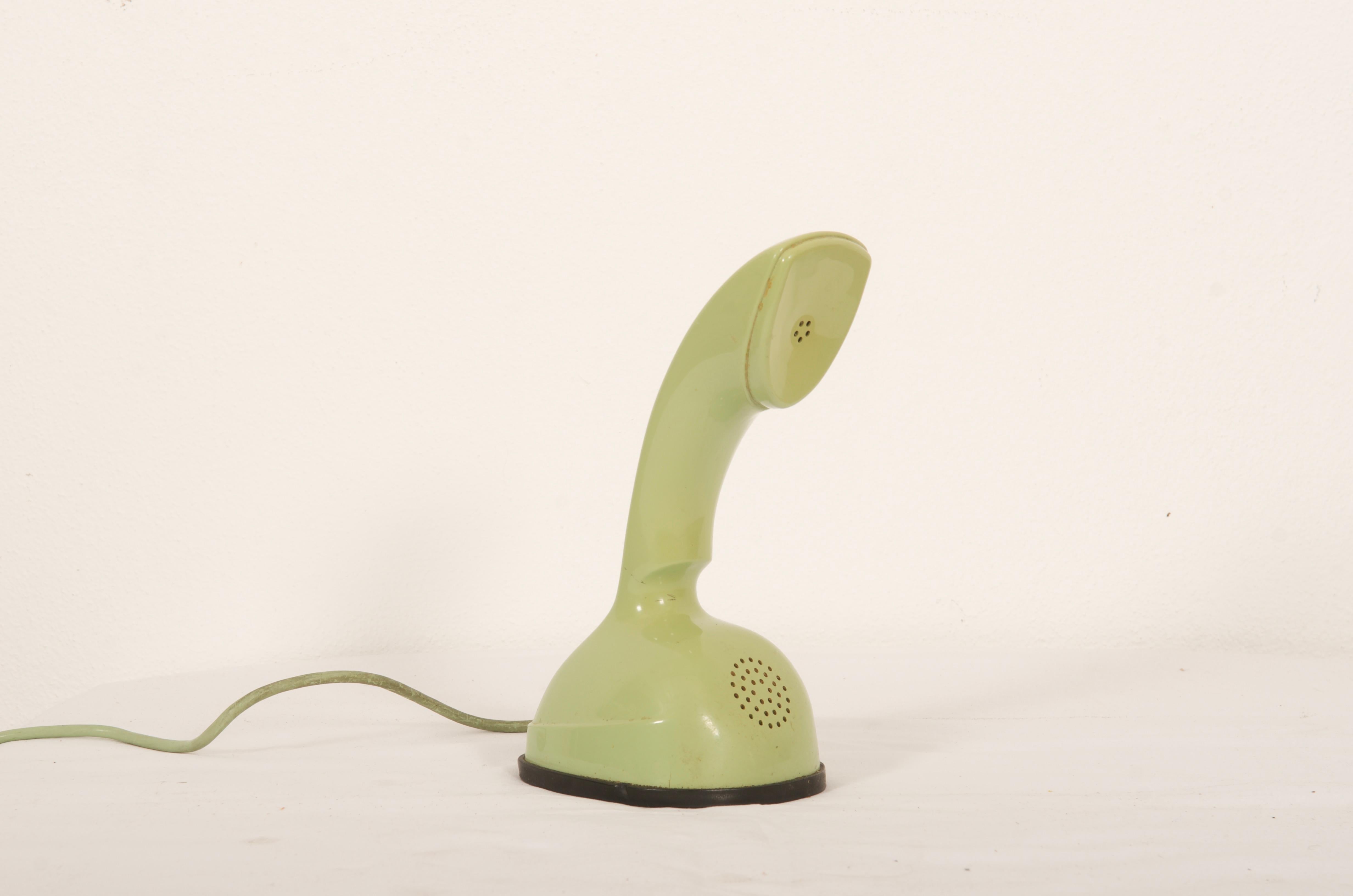 Vintage Rotary dial green ericofone. This is the model Cobra. It is made of thermoplastic ABS
Designed in the 1950s in Sweden by Hugo Blomberg, Ralph Lysell and Gösta Thames, LM Ericsson.