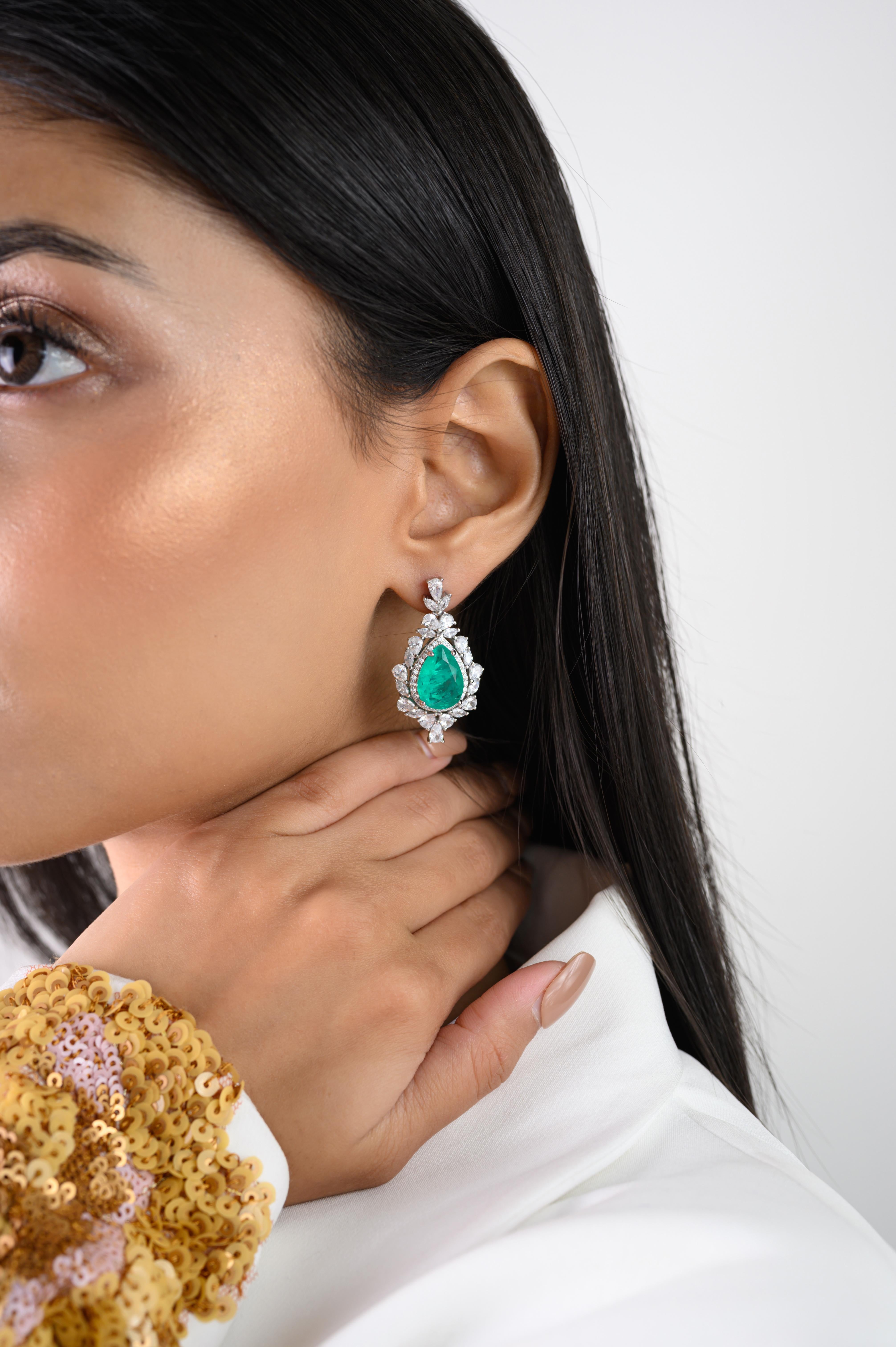 Green Color Rhinestone Tear Drop Earrings for Wedding Jewelry in sterling silver. You shall need these statement drop earrings to make a statement with your look. Each piece features dazzling cubic zirconia stones, renowned for their brilliance and