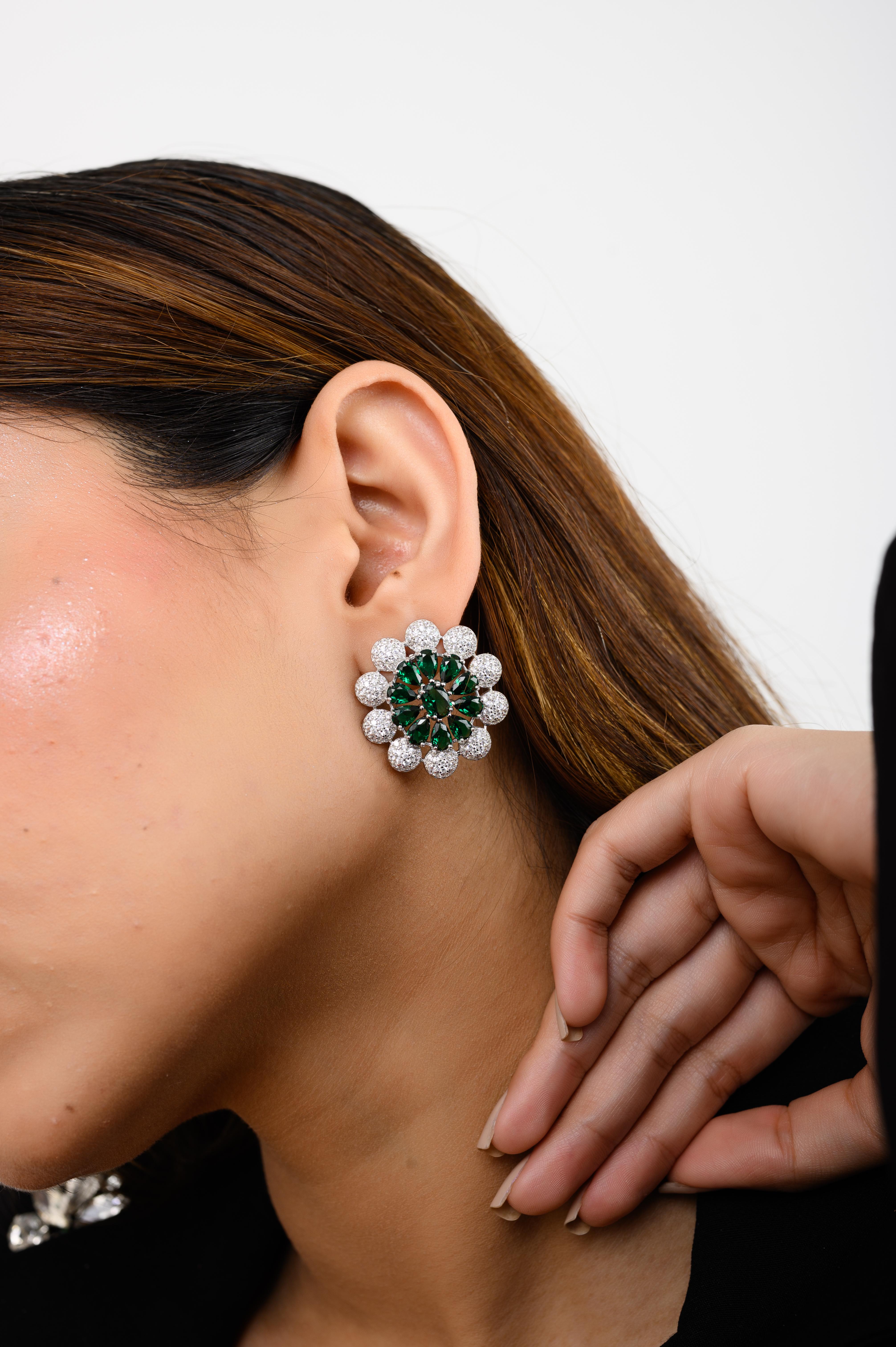 Green Color Zircon Flower Stud Earrings in sterling silver. You shall need floral stud earrings to make a statement with your look. Each piece features dazzling cubic zirconia stones, renowned for their brilliance and clarity, set in high-quality