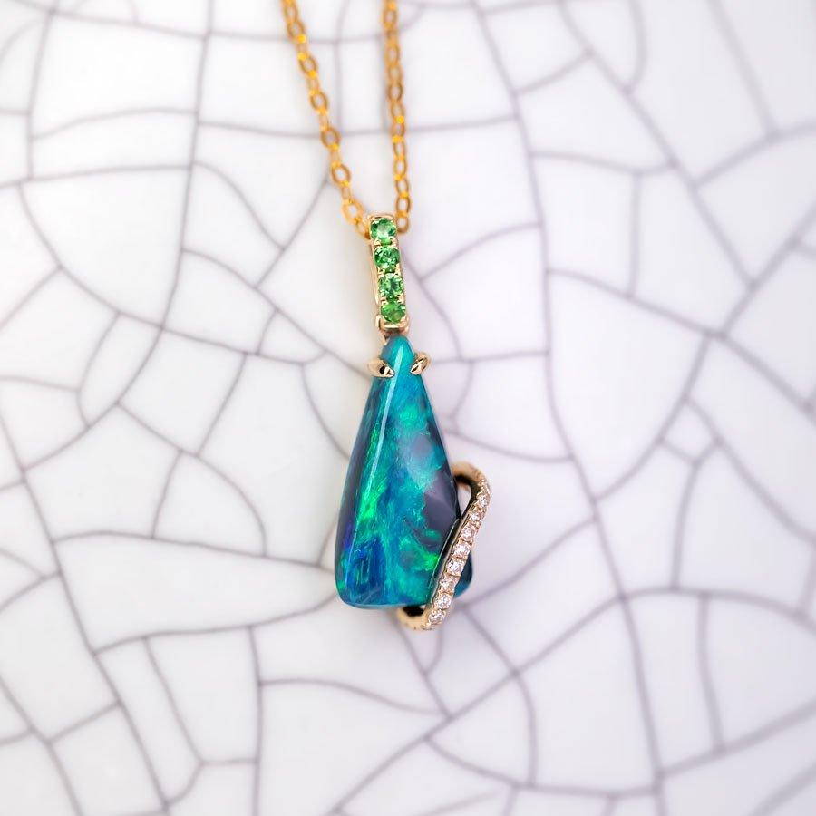 Green Colored Australian Black Opal Diamond Tsavorite Pendant Necklace 18K Yellow Gold.


Free Domestic USPS First Class Shipping!  Free One Year Limited Warranty!  Free Gift Bag or Box with every order!



Opal—the queen of gemstones, is one of the