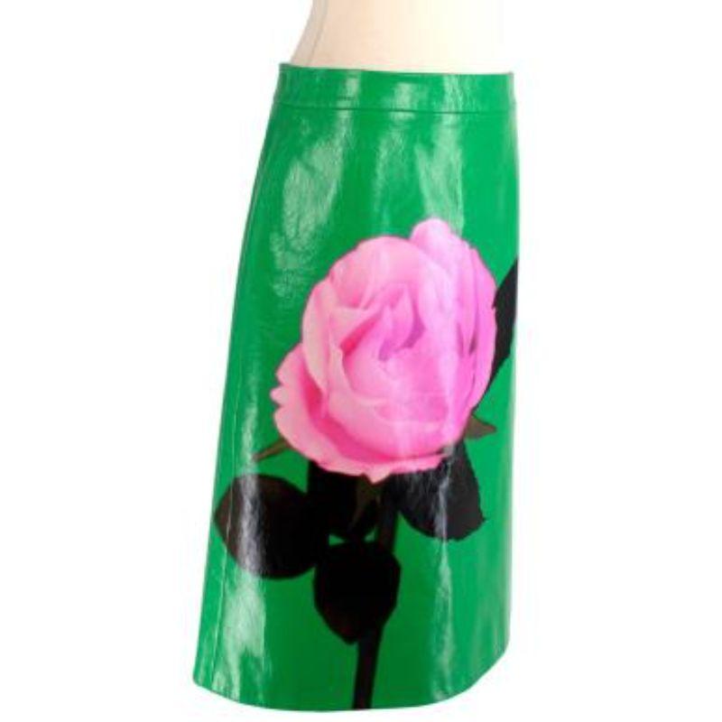 Prada Green Crackled Calfskin Rose Print A-Line Skirt
 
 
 
 -Printed graphic in black and pink at front
 
 -Zip closure at outseam
 
 -Central vent at back hem
 
 -Tonal viscose-blend lining
 
 -Tonal hardware
 
 -Fully lined
 
 -Zip fastening