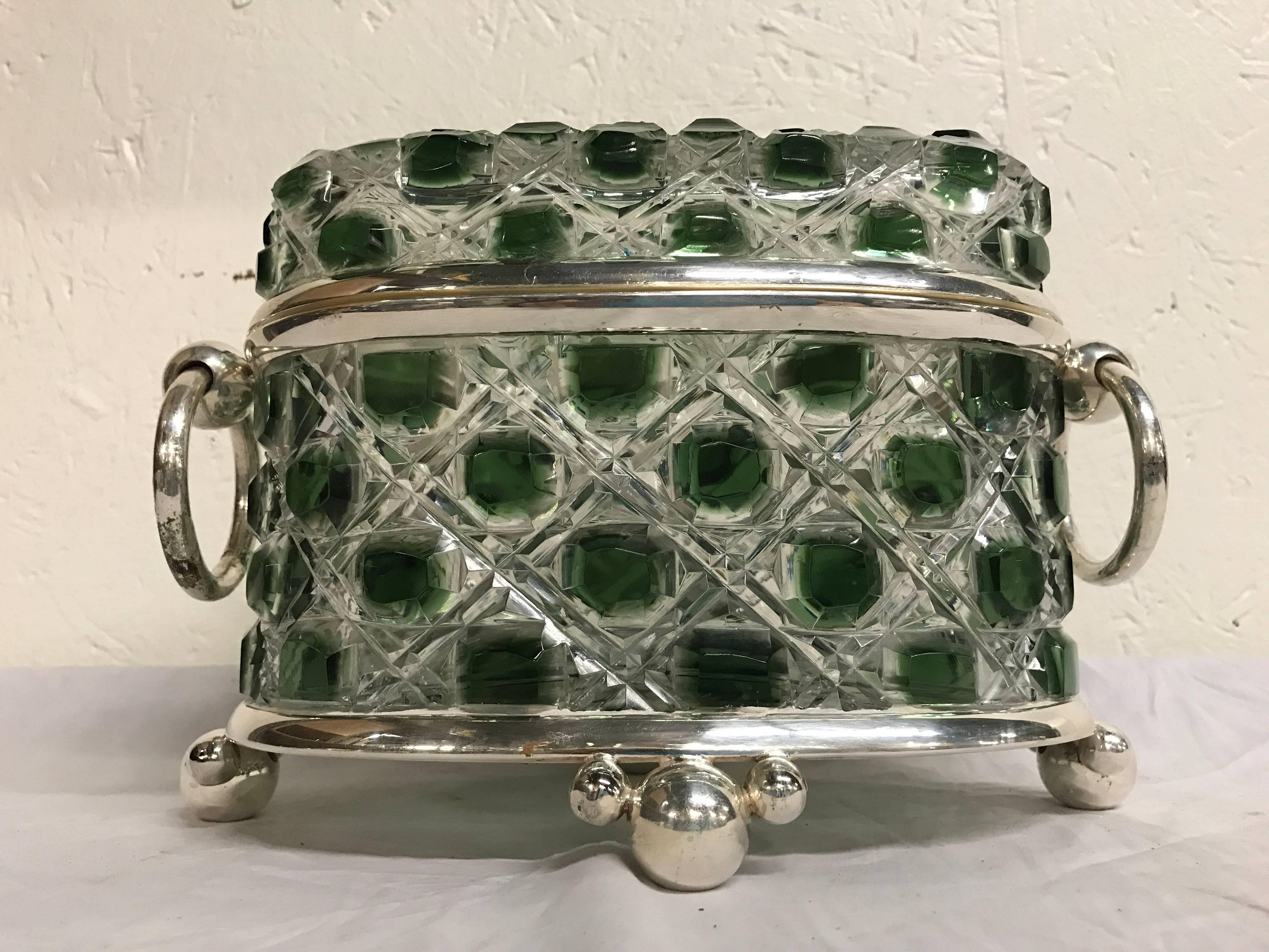 Green cut to clear table box attributed to Baccarat, of oval form with large ring handles, raised on four ball feet.