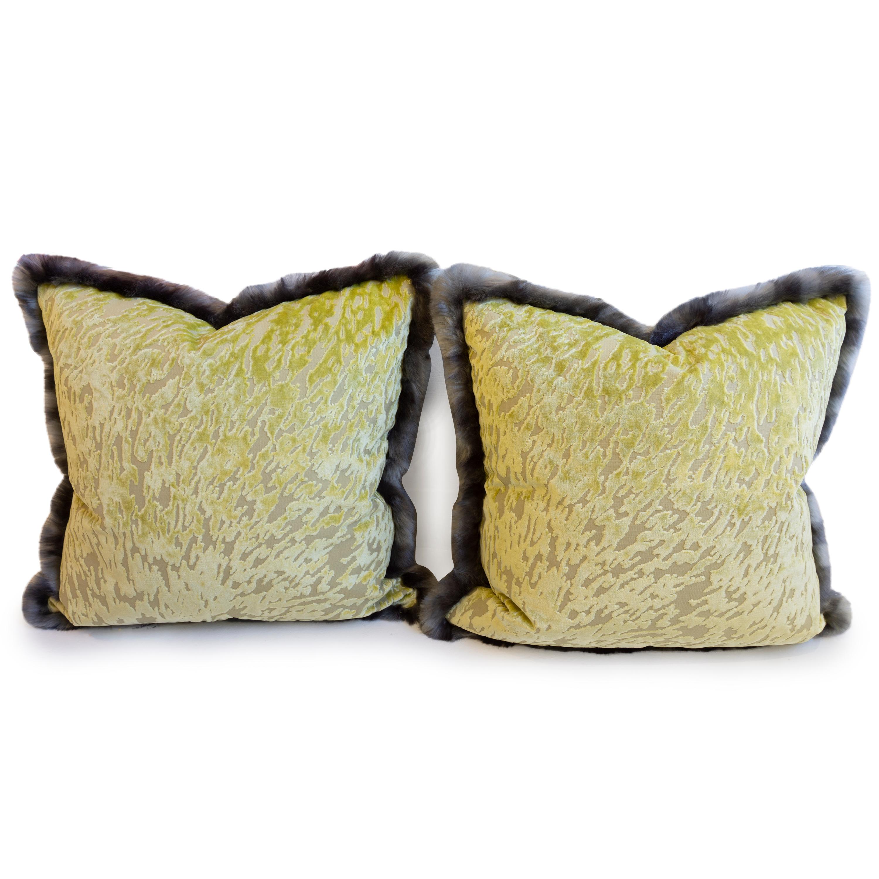 This pair of green cut velvet throw pillows feature a grey faux fur trim and are luxurious to touch. The pillows create an eccentric accent to the room. All pillows are hand sewn at our studio in Norwalk, Connecticut. 

Measurements: 21