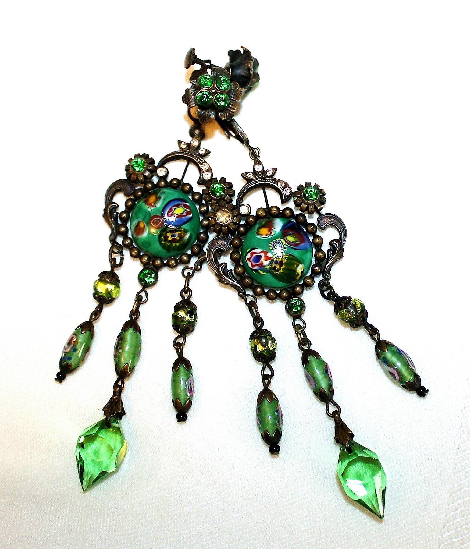 Czechoslovakian long, dangling, darkened brass earrings set with round art glass cabochons and embellished with green and clear faceted glass stones and dangling chains of green glass beads. The backing is a screw/clasp back that allows for tension