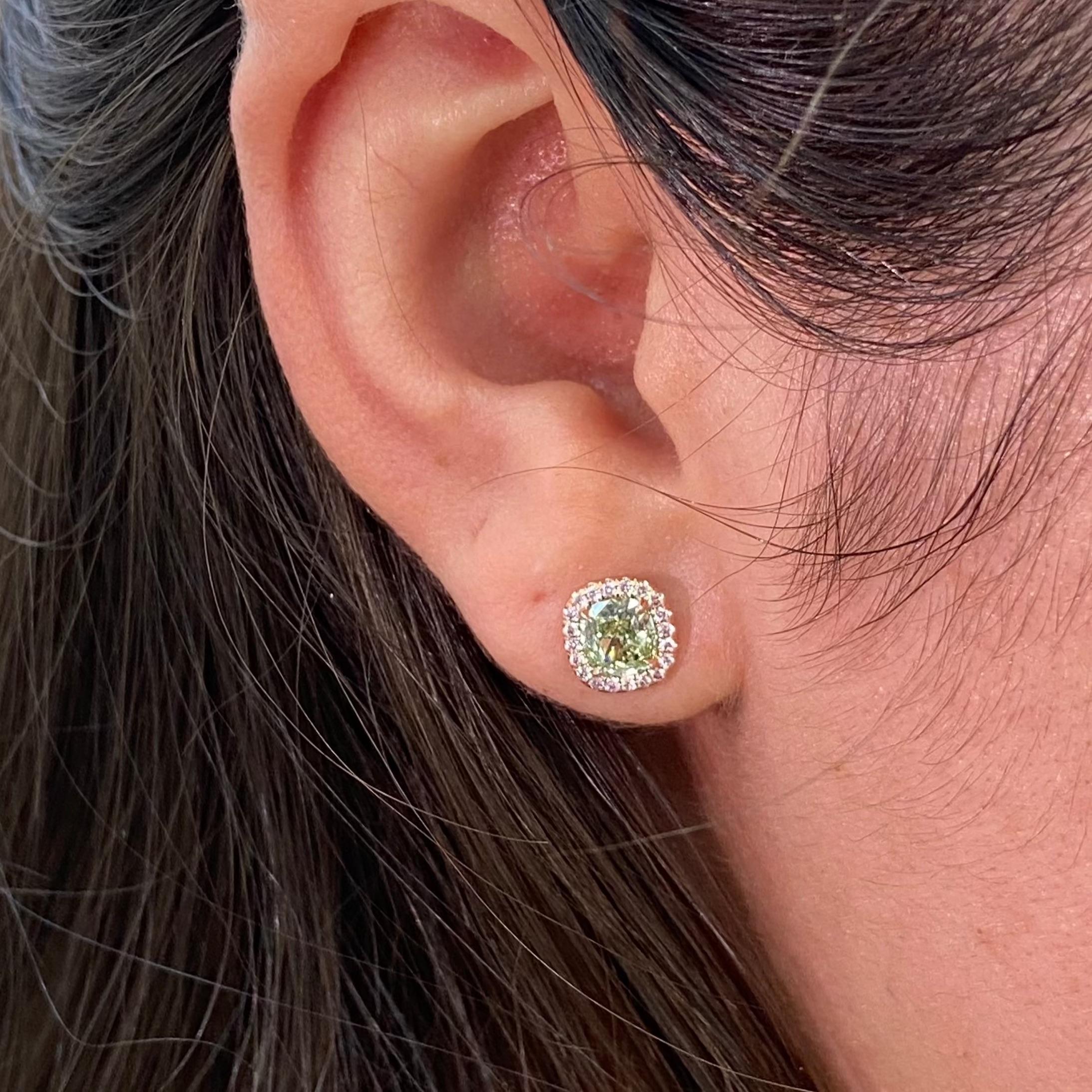 0.87 and 0.86 Carat Fancy Yellow-Green Diamonds
Cushion Cut Diamonds
VS1 and VS2 Clarity
GIA Certified Diamonds
No Fluorescence
0.21 Carats of Surrounding Fancy Pink Rounds in Halo
Handmade in NYC

This piece can be viewed before purchase in our