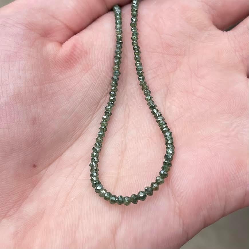 Contemporary Green Diamond Strand with a 14 Karat Yellow Gold Clasp For Sale