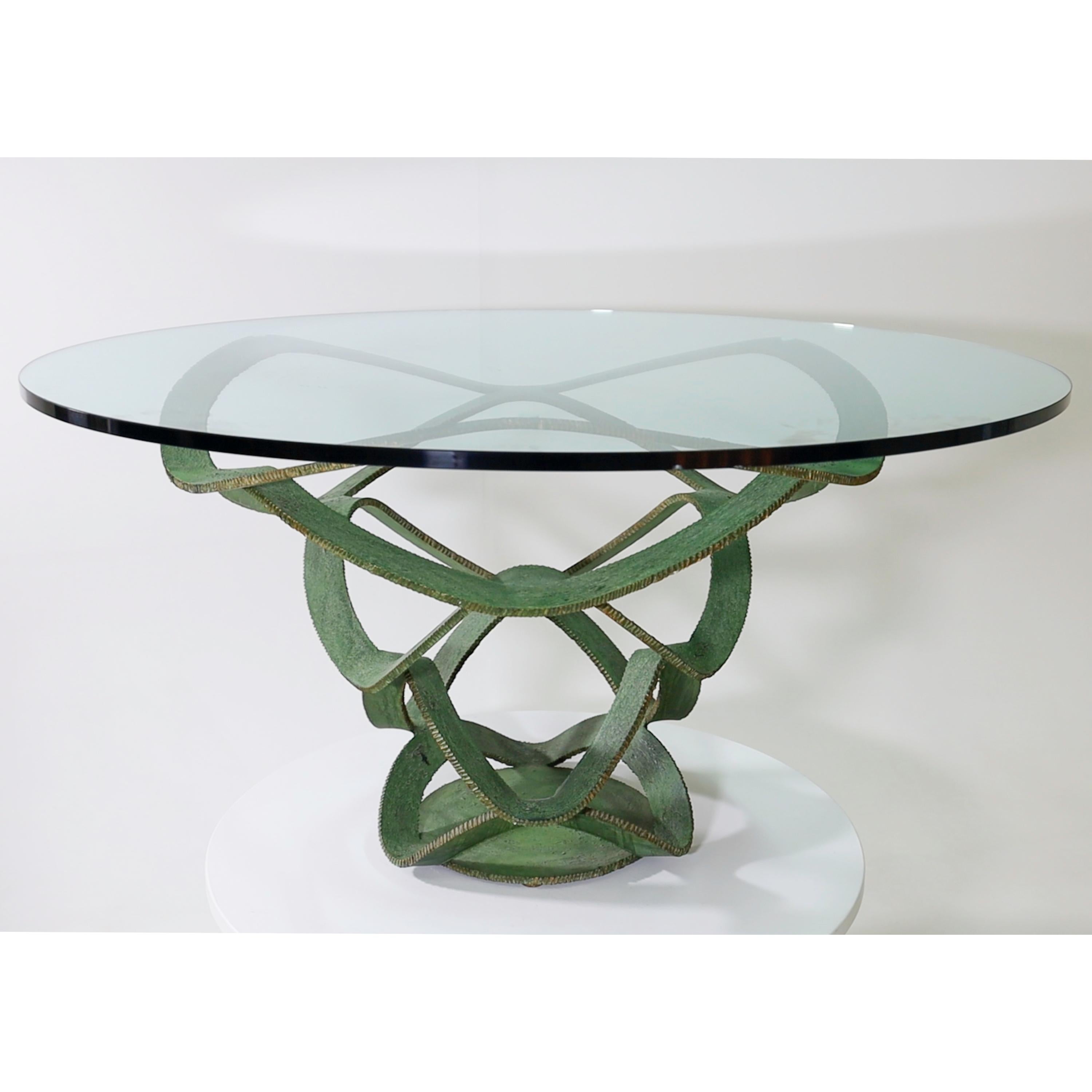 Large table with twisted green iron frame and round table top, attributed to Maurice Barilone.