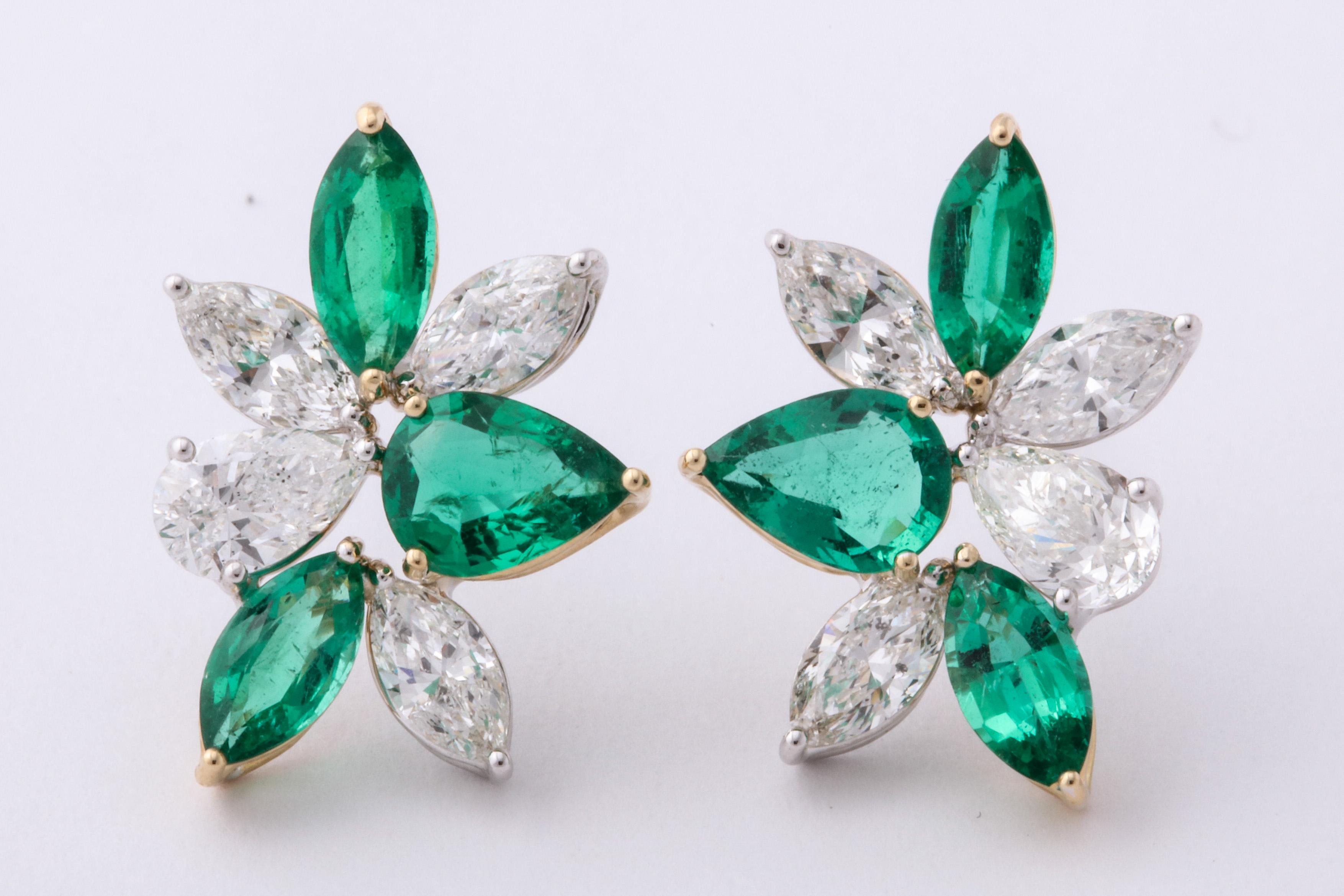 
A unique pair of cluster earrings with a POP of color!

2.18 carats of white pear shape and marquise cut diamonds

2.01 carats of fine green pear and marquise cut emeralds 

18k white and yellow gold 

A 3/4 of an inch long and a little over half
