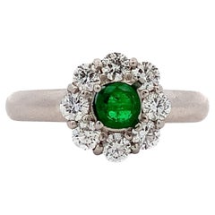 Green emerald and diamond cluster engagement ring platinum
