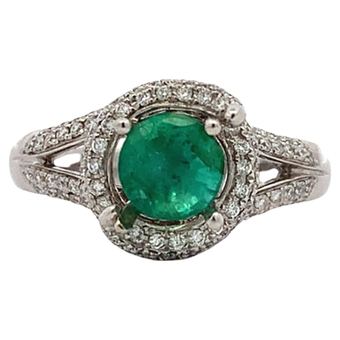 Green emerald and diamond engagement ring 18k white gold