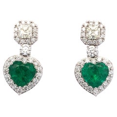 Green emerald and diamond heart shaped drop earrings 18k white gold