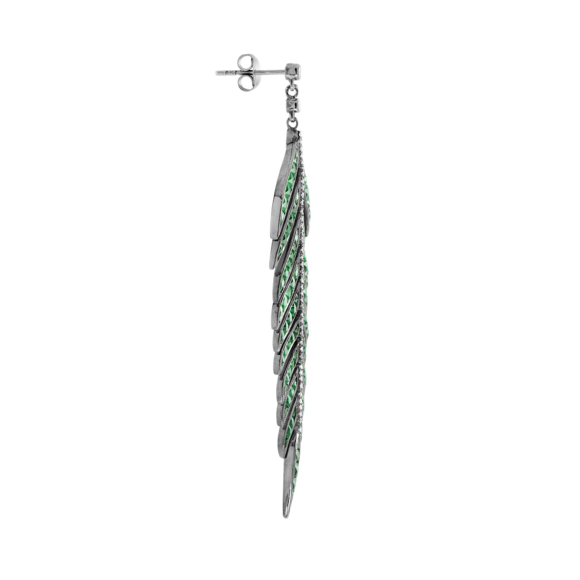 Dress up her ears in nature inspired elegance with these sophisticated green emerald and diamond leaf drop earrings. Crafted in black rhodium plating 18k white gold, each earring showcases an inspiring open design shimmering with emeralds total 15.1