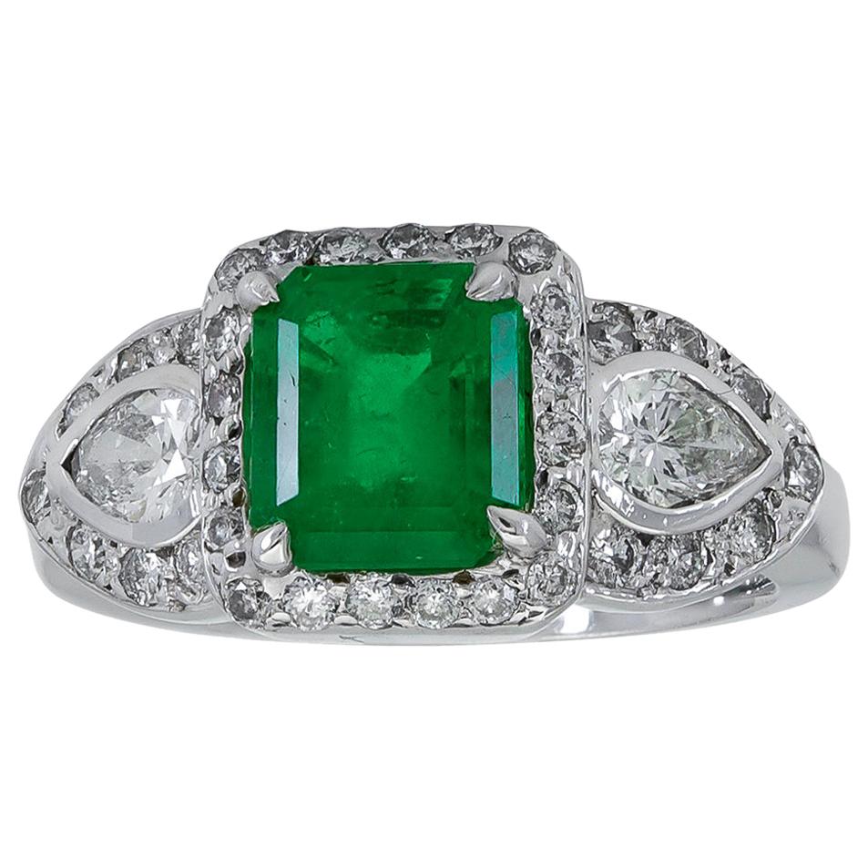 Green Emerald and Diamond Three-Stone Halo Engagement Ring