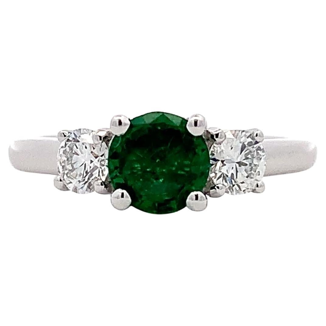 Green emerald and diamond trilogy engagement ring 18k white gold