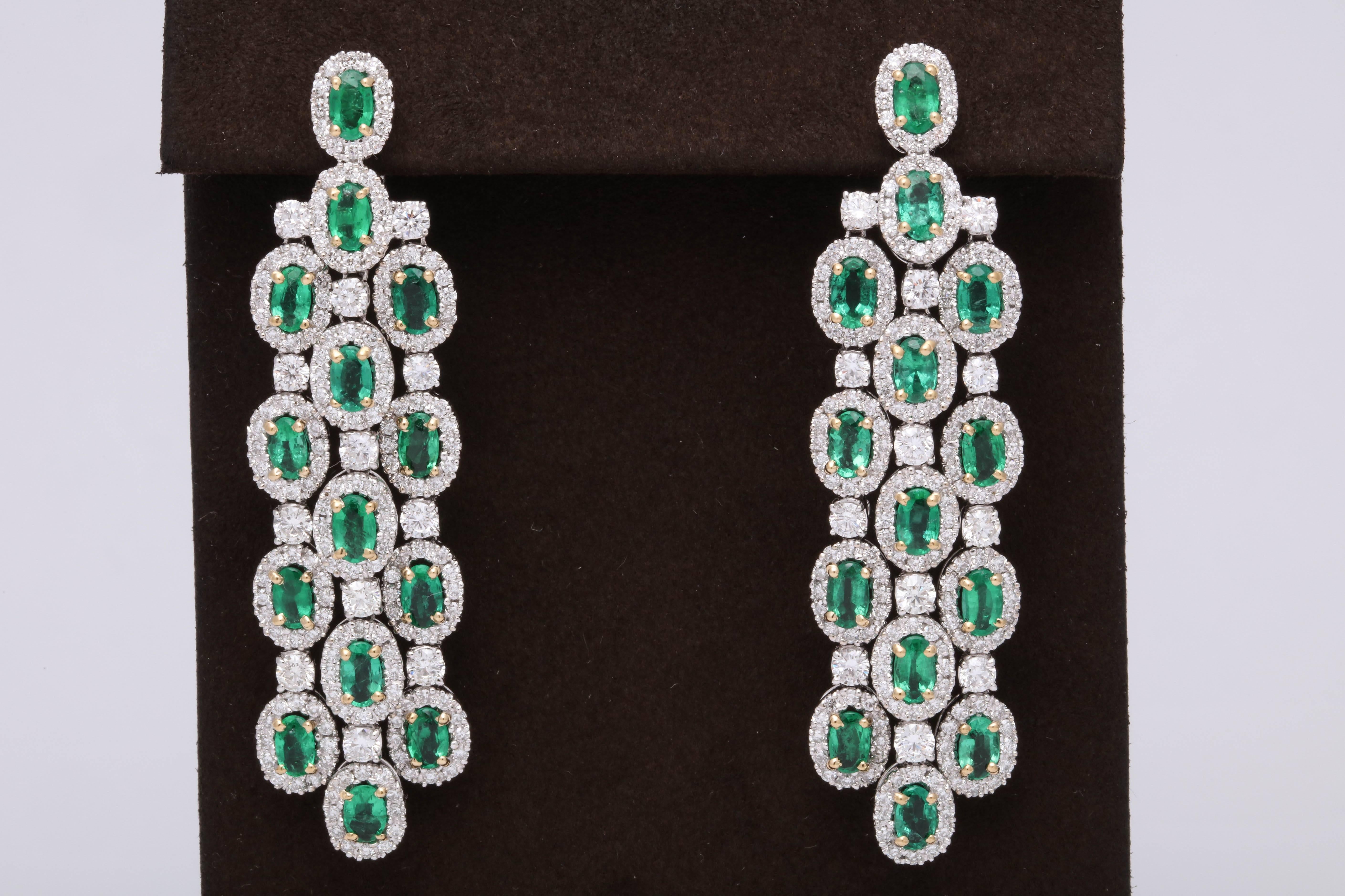 


A beautiful pair of classic chandelier earrings with a pop of GREEN!

6.50 carats of green emeralds 

4.93 carats of white round brilliant cut diamonds

18k white gold with yellow prongs. 

Approximately 2.36 inches in length, .70 inches wide.