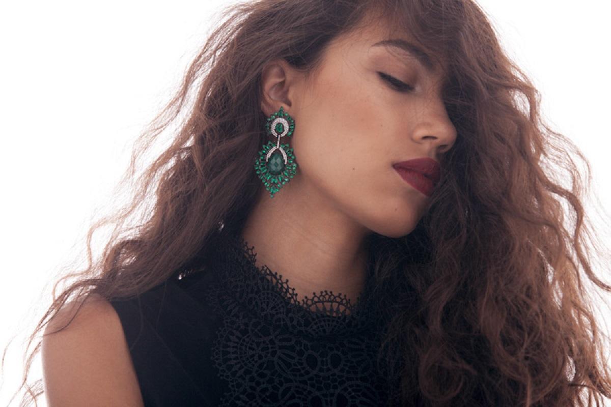 Dare to dazzle with these masterfully hand crafted chandelier earrings.  Part of our Amirat = Princesses collection. Rhodium plated sterling silver with hand set clear and emerald green zircon with green jade center stone. Made with the princess we