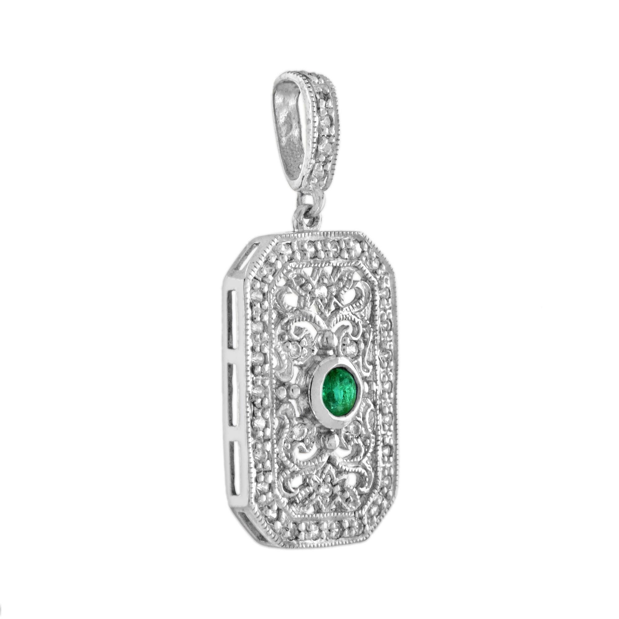 Featuring a 0.09 carat emerald at the center and an ornate, vintage inspired design, this pendant is fit for any outfit. The colorful center stone is accent by sparkling round cut white diamonds that total to 0.19 carats set on 14k white gold floral