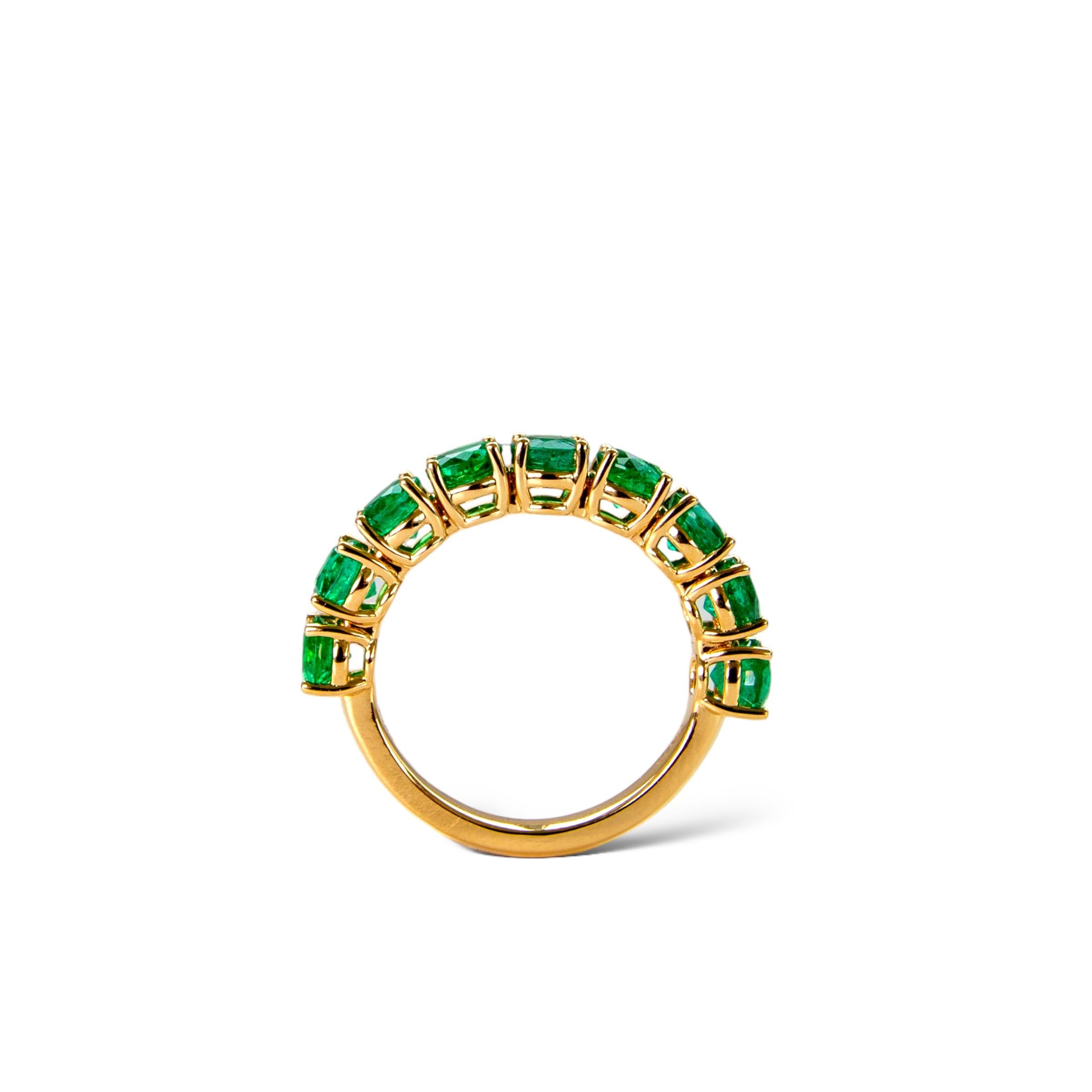 Beautiful Zambian green emerald eternity ring featuring 9 round natural emeralds set in a solid 18k yellow gold ring.

Emeralds are said to bring good fortune and good luck to the wearer, and to attract wealth. In addition, emeralds are believed to