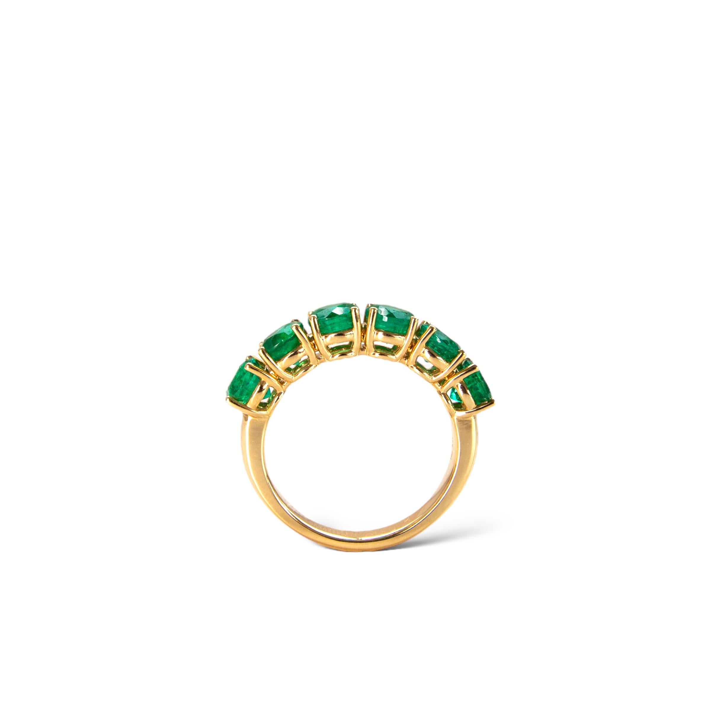 Beautiful Zambian green emerald eternity ring featuring 9 round natural emeralds set in a solid 18k yellow gold ring.

Emeralds are said to bring good fortune and good luck to the wearer, and to attract wealth. In addition, emeralds are believed to