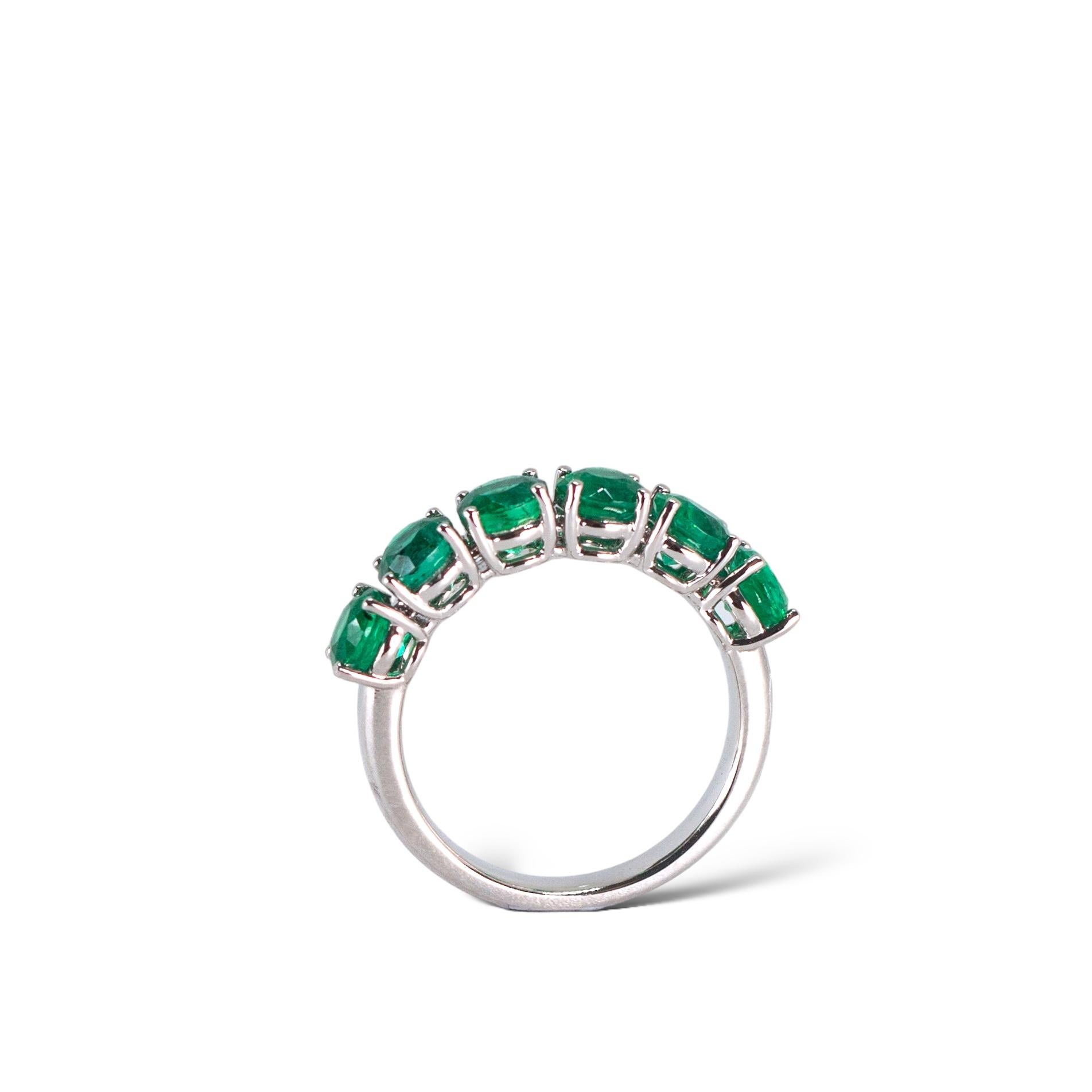 Round Cut Green Emerald Eternity Band in Platinum For Sale