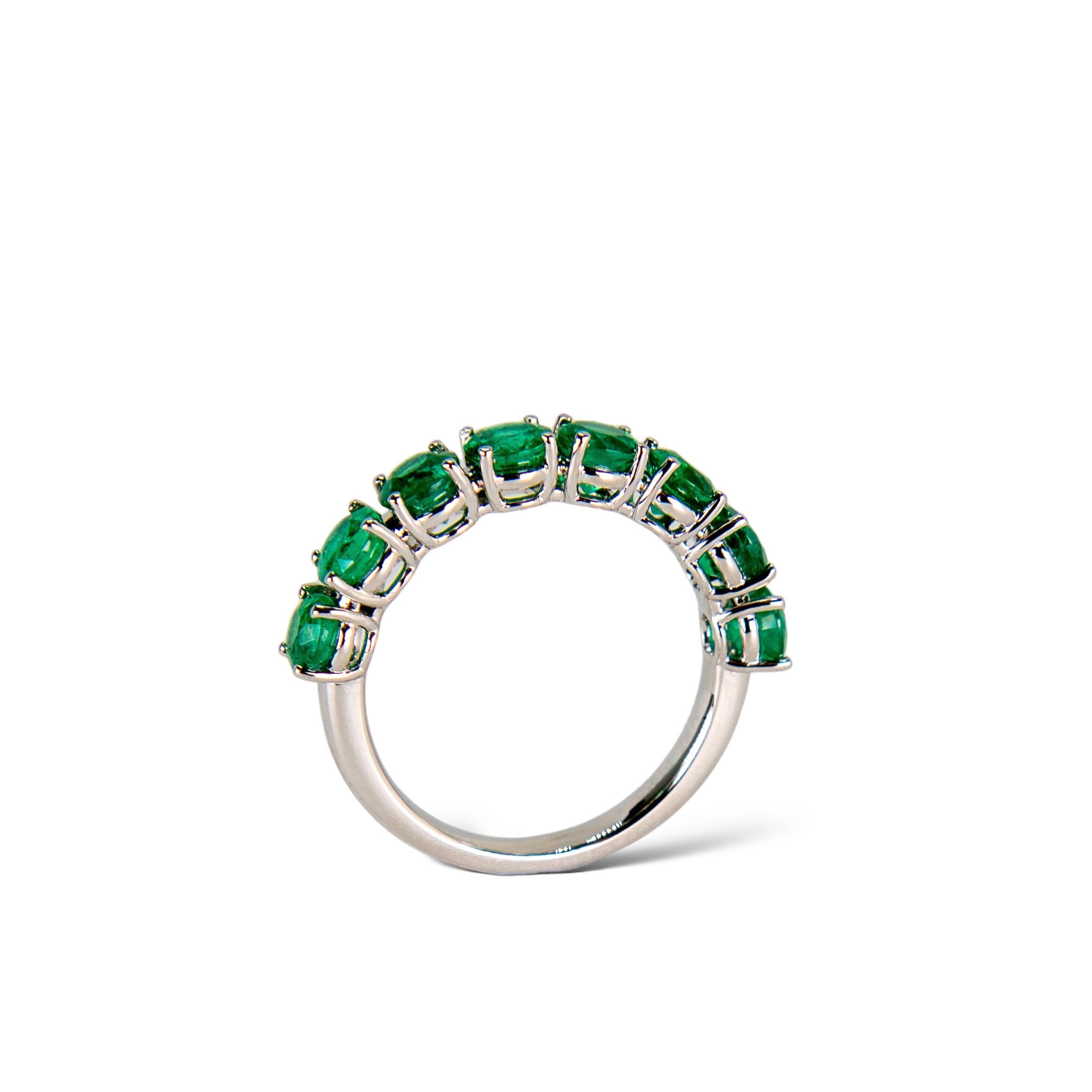 Round Cut Green Emerald Eternity Band in Platinum For Sale
