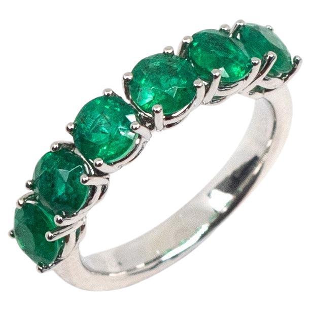 Green Emerald Eternity Band in Platinum For Sale