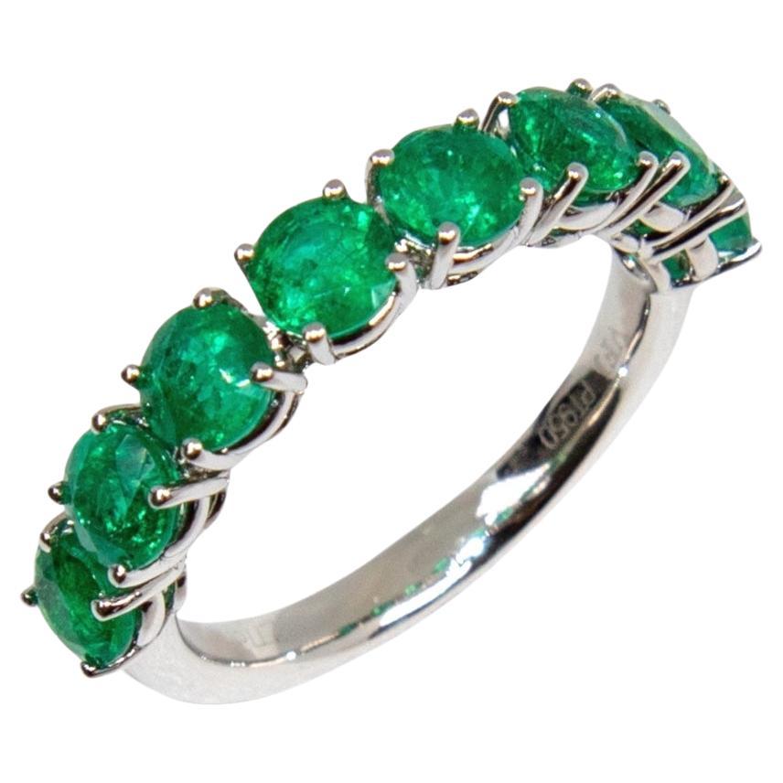 Green Emerald Eternity Band in Platinum For Sale