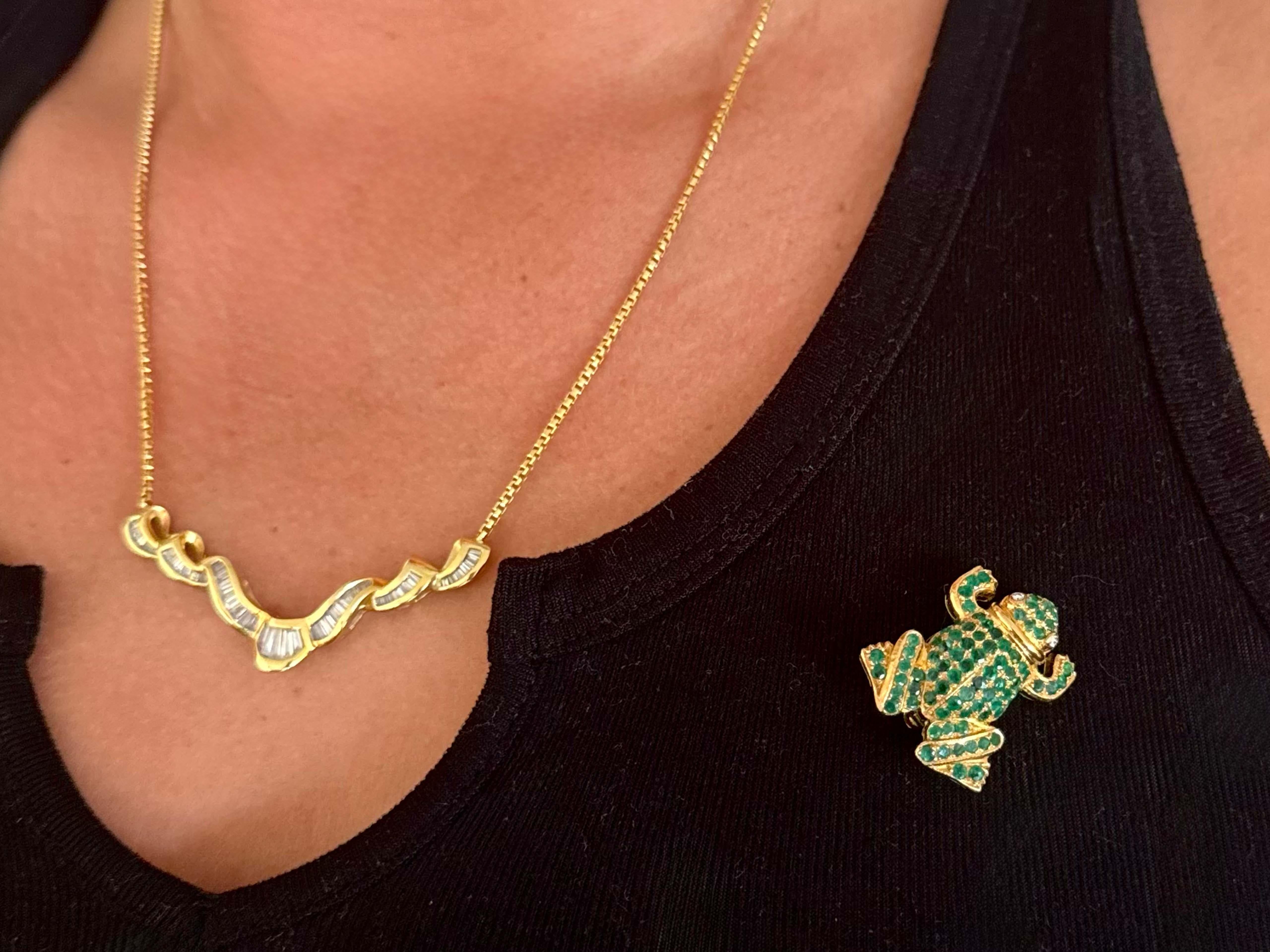 Add a touch of nature-inspired luxury to your collection with this exquisite Green Emerald Frog Brooch. Crafted in 18K solid yellow gold, this stunning piece features approximately 1.50-2.00 carats of vivid green emeralds set in a beautifully