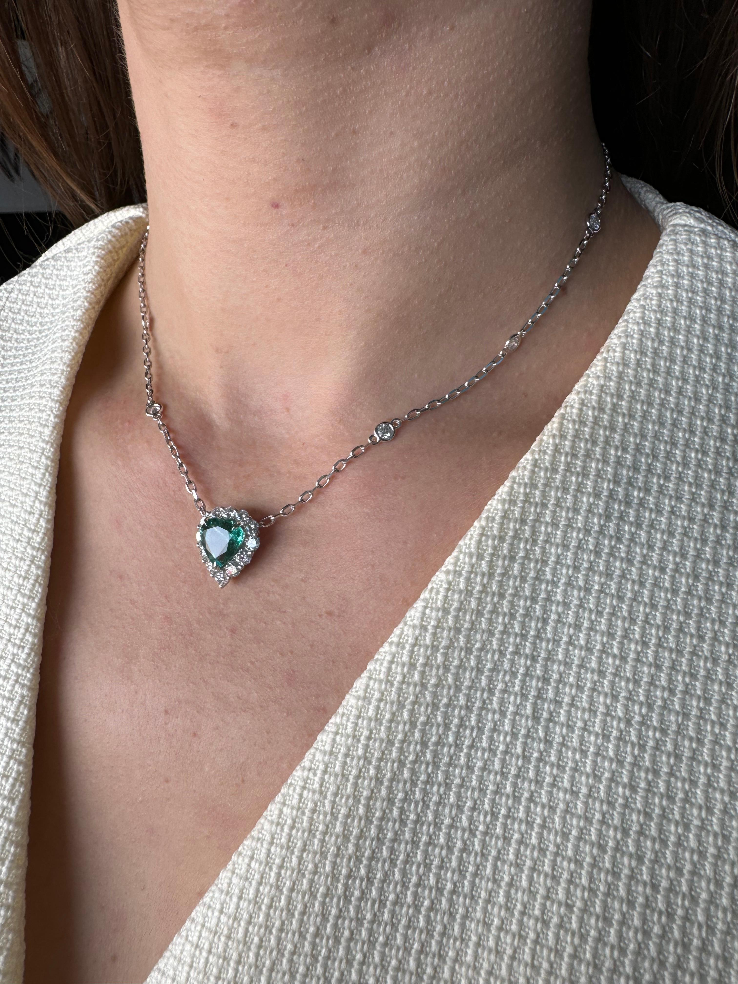 Embrace the refined beauty of this exquisite gemstone heart-shape pendant necklace.  Crafted with solid 18K gold and intricate detailing, the necklace features the highest-quality faceted diamond-cut chain that gracefully holds a natural brilliant