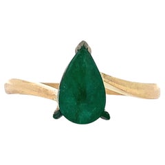 Green emerald pear shaped engagement ring 18k yellow gold