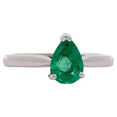 Green emerald pear shaped solitaire engagement ring 18k white gold