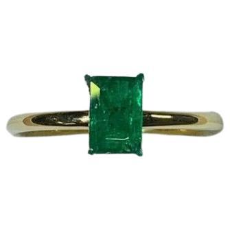 Green Emerald Solitaire Engagement Ring In 18ct Yellow gold For Sale