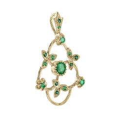 Ciondolo in oro giallo con smeraldo verde e foglie in stile vintage