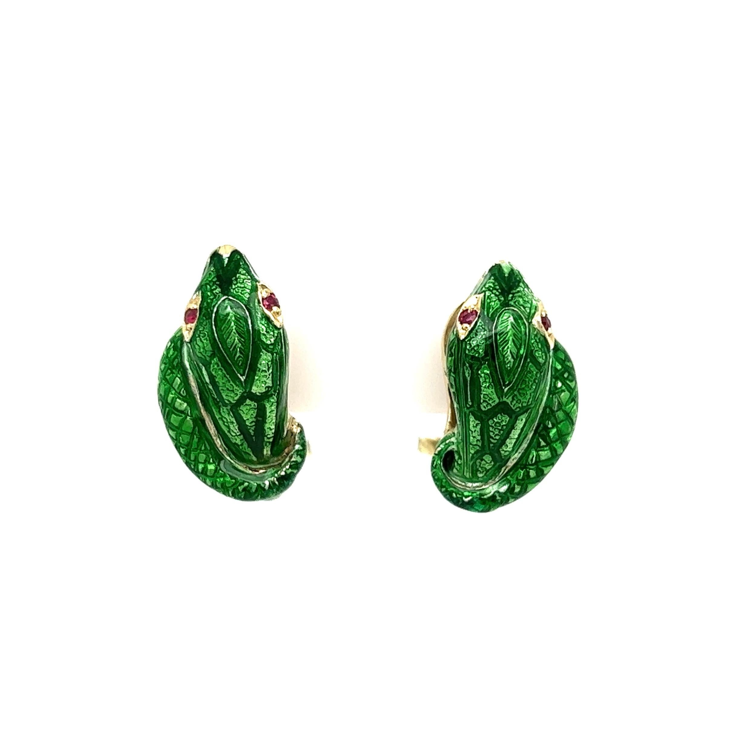Striking Designer Victor Mayer Green Enamel Serpent and Hand set Ruby Eyes Gold Earrings. Hand crafted in 14K Yellow Gold. This piece has a wonderful, old-world charm. A wonderful decadent example of the Egyptian Revival style! Super Cool Classic