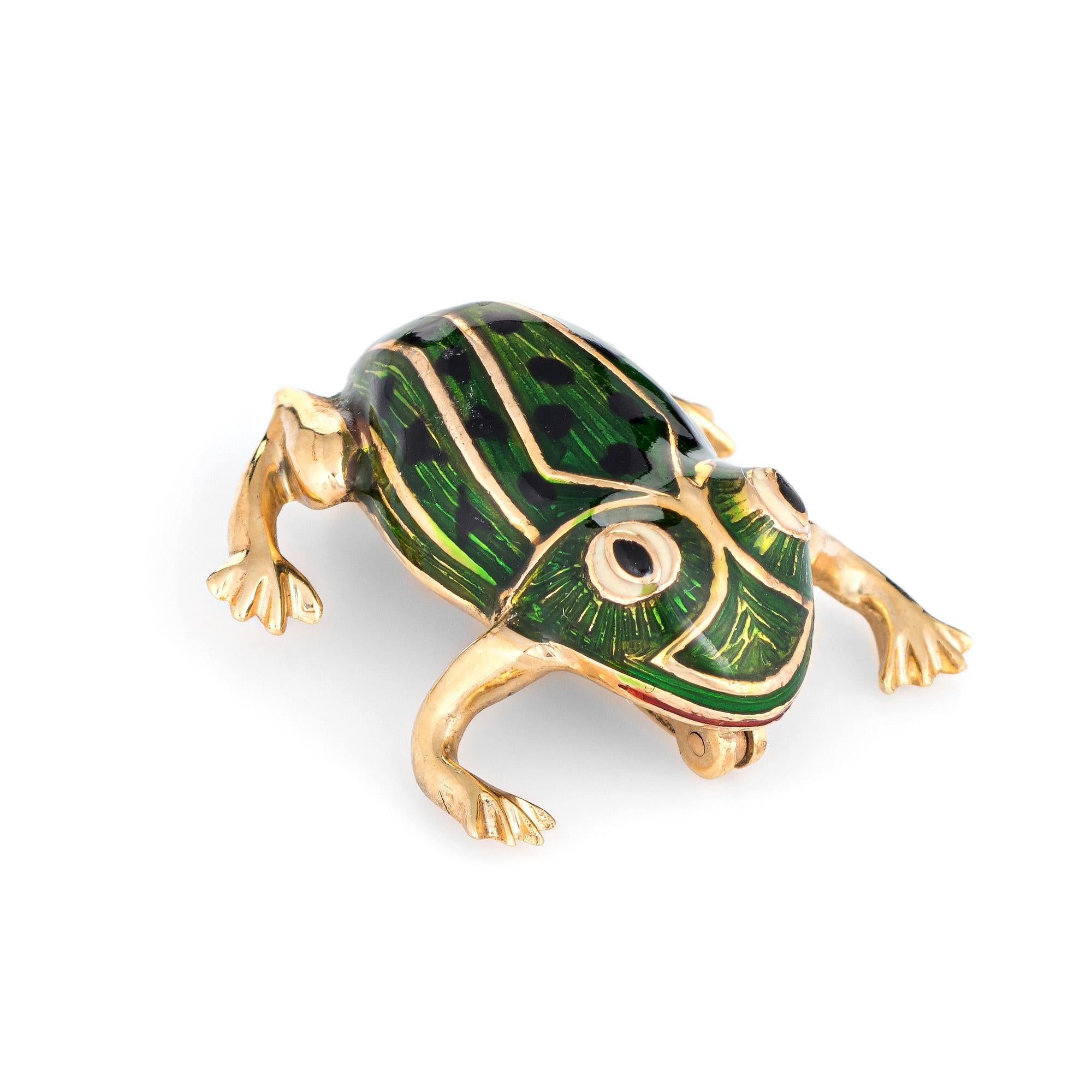 Finely detailed vintage frog brooch (circa 1960s to 1970s) crafted in 14 karat yellow gold. 

The happy frog features green enamel with black spots to the back. The frog is ideal worn on a lapel or sleeve cuff for a different look.

The brooch is in