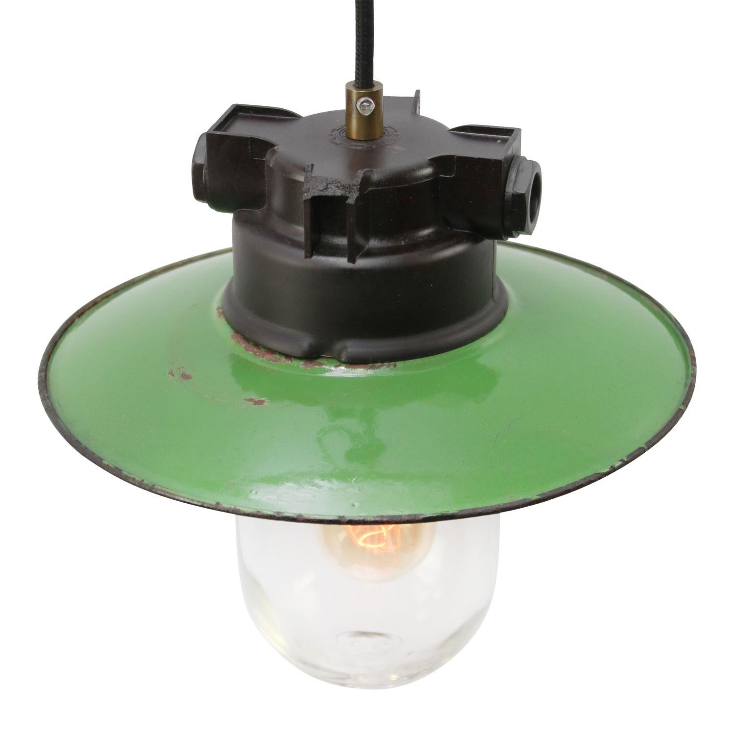Bakelite industrial hanging lamp.
Green Enamel shade and clear glass.

Weight: 1.40 kg / 3.1 lb

Priced per individual item. All lamps have been made suitable by international standards for incandescent light bulbs, energy-efficient and LED