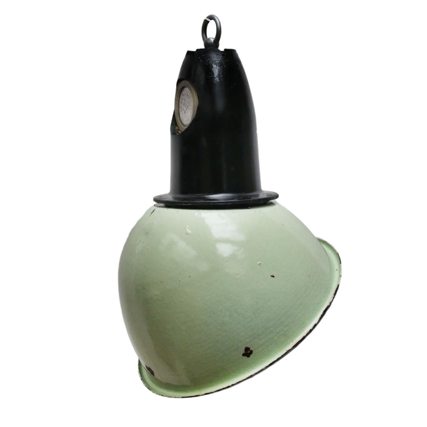 Asymmetrical industrial lamp made of green enamel with Bakelite top.
White interior. 

Weight 1.35 kg / 3 lb

Priced per individual item. All lamps have been made suitable by international standards for incandescent light bulbs,