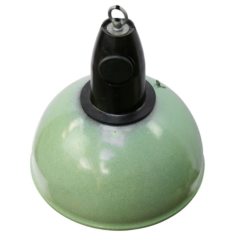Rare industrial lamp made of green enamel
Bakelite top.
white interior

Weight: 1.50 kg / 3.3 lb

Priced per individual item. All lamps have been made suitable by international standards for incandescent light bulbs, energy-efficient and LED