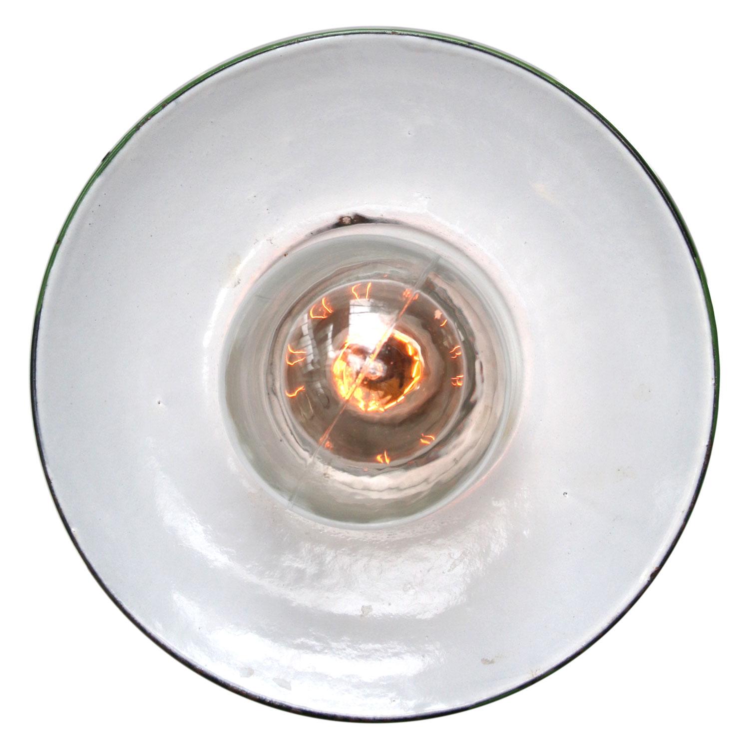 Porcelain Industrial hanging lamp.
White porcelain, cast iron and clear glass.
green enamel shade
2 conductors, no ground.

Weight: 1.80 kg / 4 lb

Priced per individual item. All lamps have been made suitable by international standards for