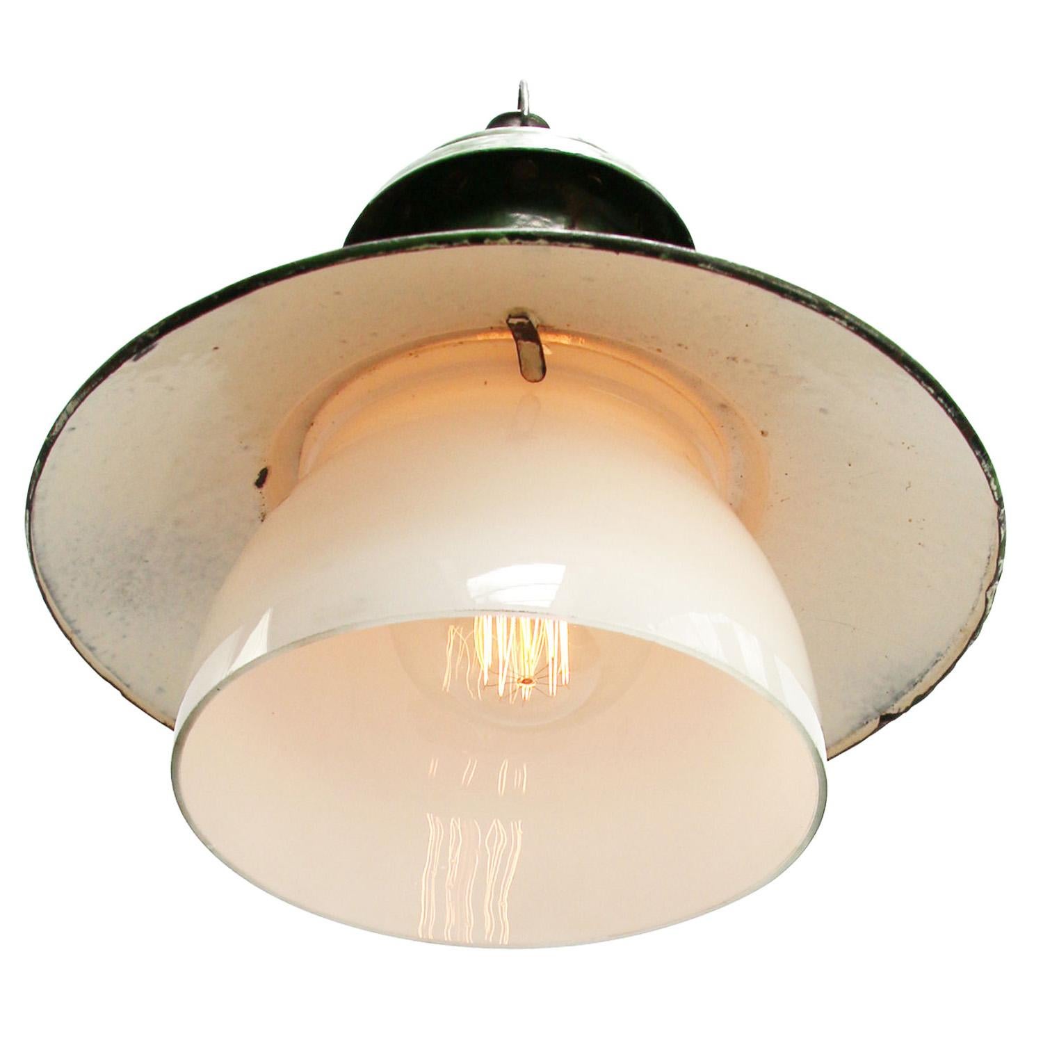 Green enamel factory pendant.
White inside. White opaline glass

Measure: Diameter glass 21 cm

Weight: 2.20 kg / 4.9 lb

Priced per individual item. All lamps have been made suitable by international standards for incandescent light bulbs,