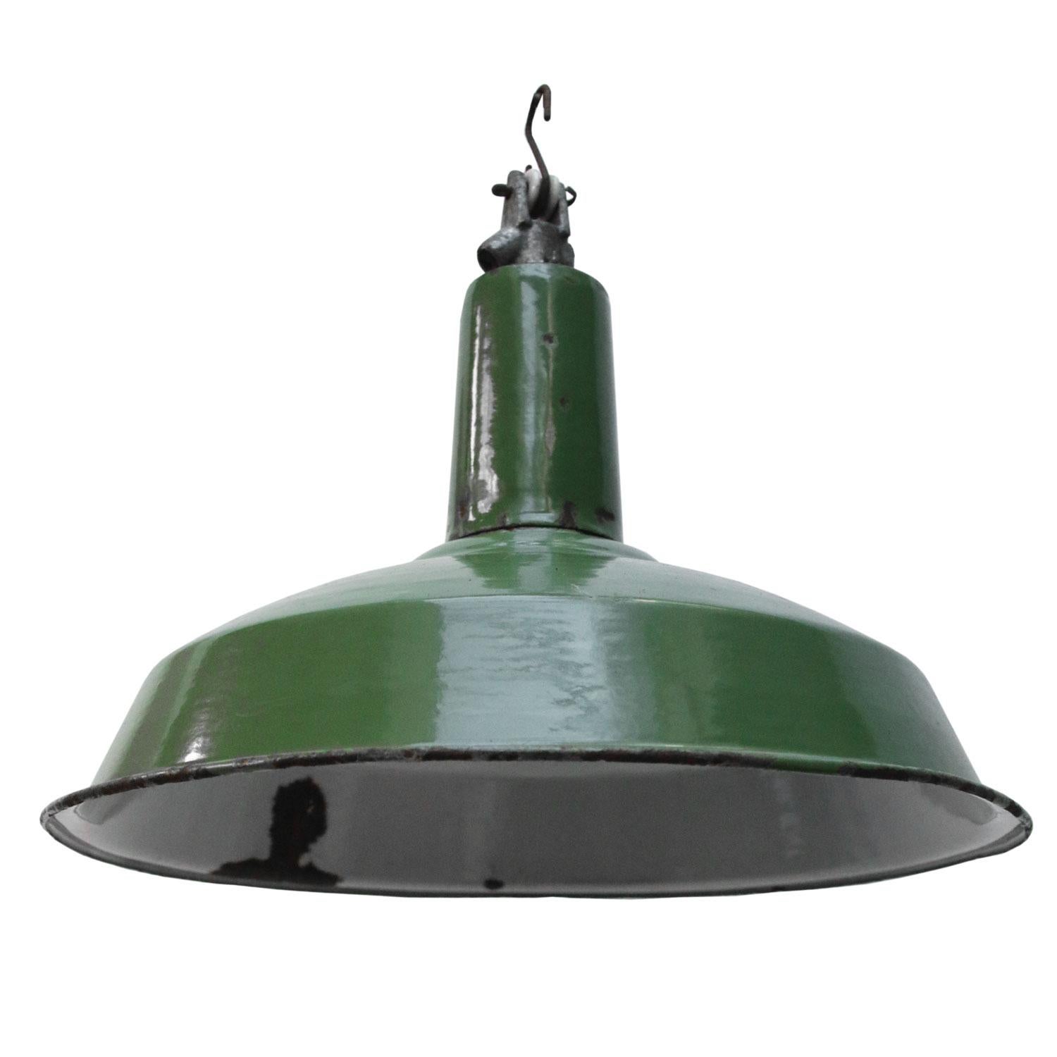 Dark green enamel factory pendant from Provence, France.
White interior.

Weight: 1.2 kg / 2.6 lb

Priced individual item. All lamps have been made suitable by international standards for incandescent light bulbs, energy-efficient and LED bulbs.