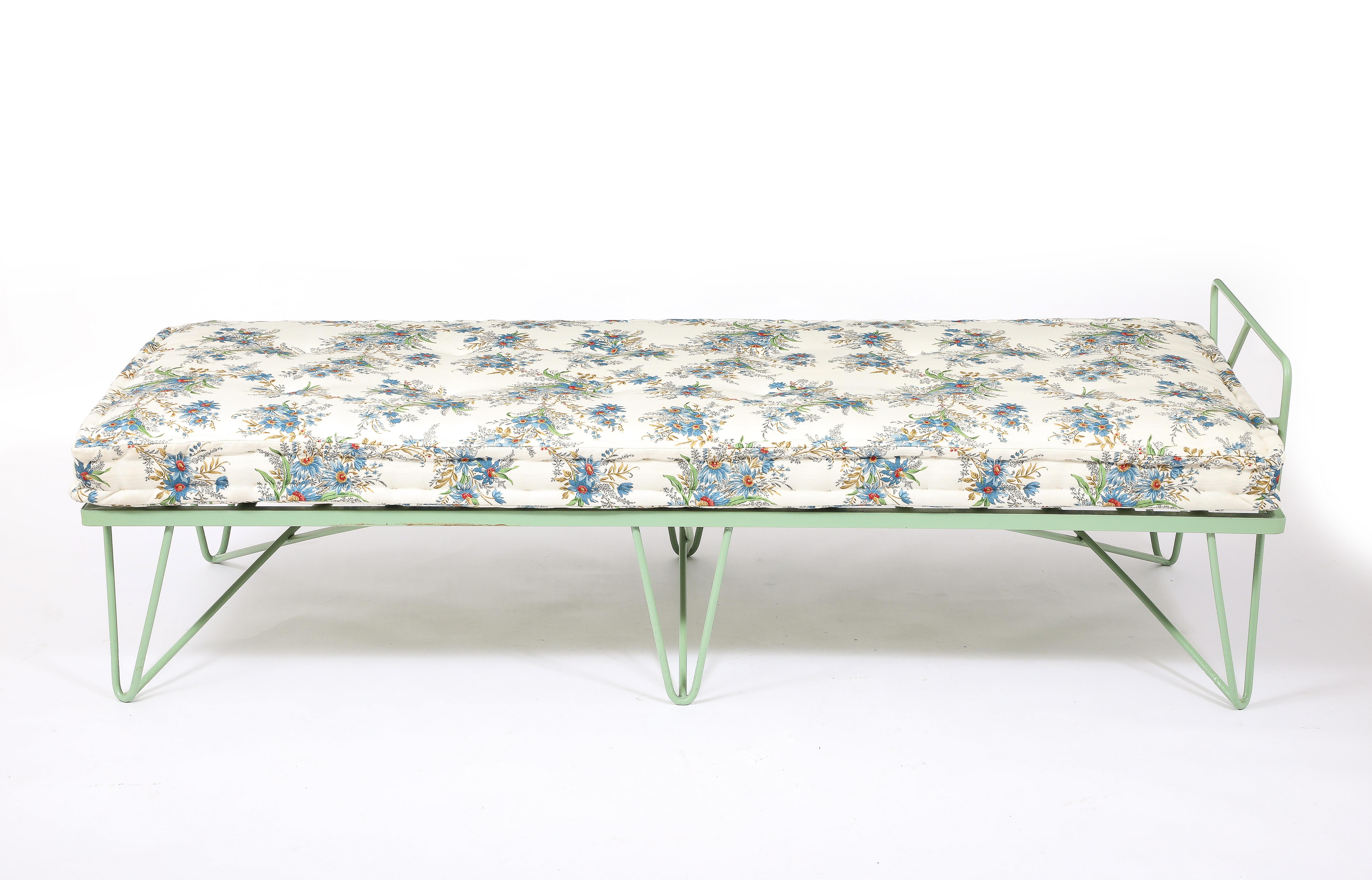 1950s green enameled wrought iron daybed with a new French mattress upholstered in a floral pattern.