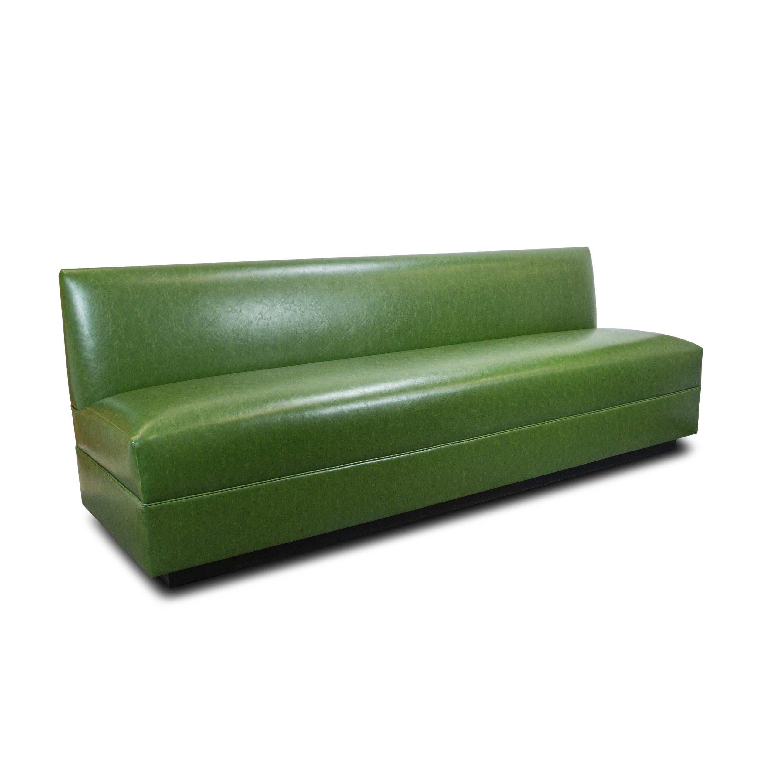 Modern tight seat banquette custom made for kitchens, dining rooms, etc. Easy to clean and maintain, here it's upholstered with 8-way hand tied springs in green faux leather. The base is stained in our signature 
