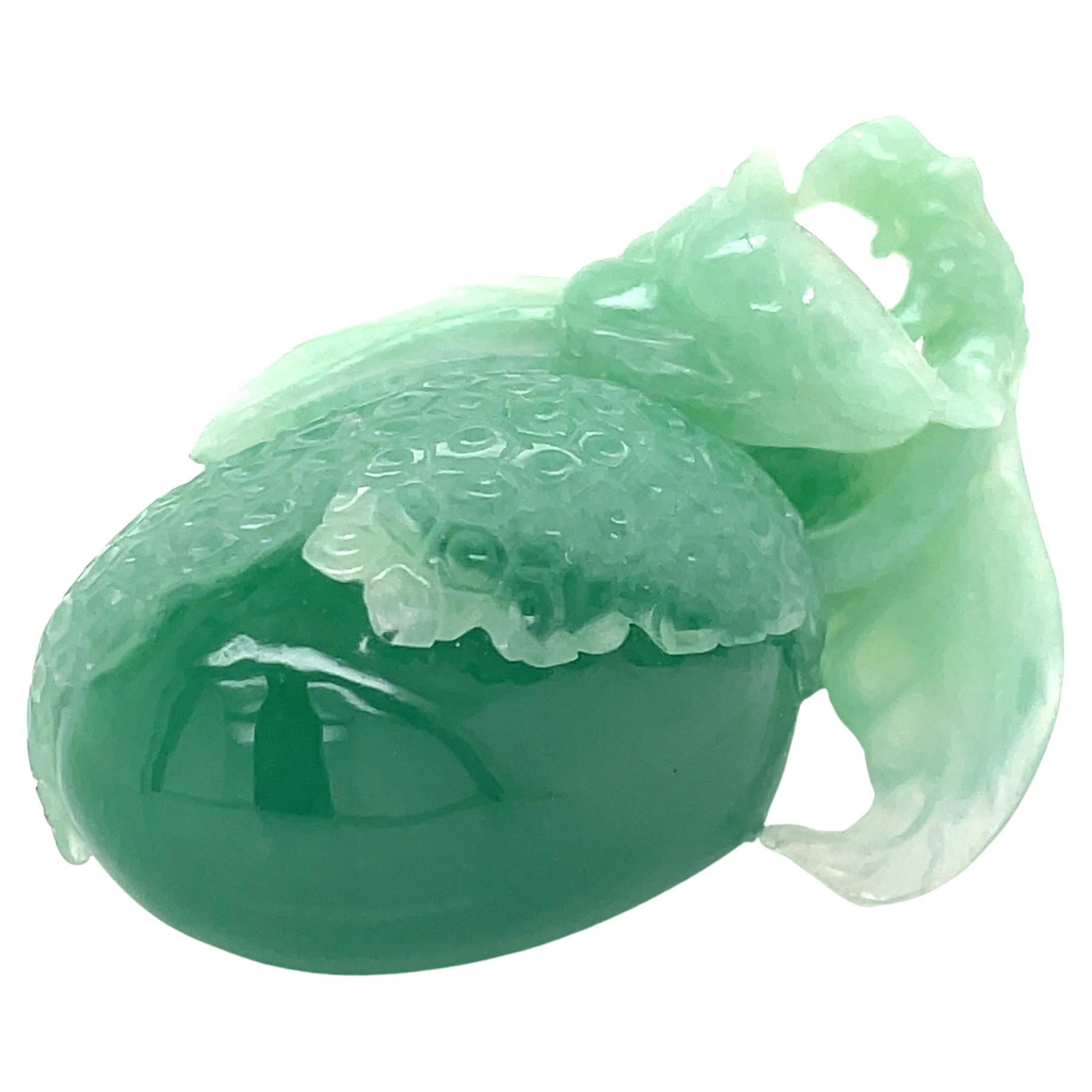 This exquisite Green Fruit Chalcedony Carving (45 x 22mm) is a unique piece, meticulously crafted to highlight the stone’s natural beauty. 

Sourced from Myanmar, this rare chalcedony variety is admired for its soft green hue and smooth, glossy