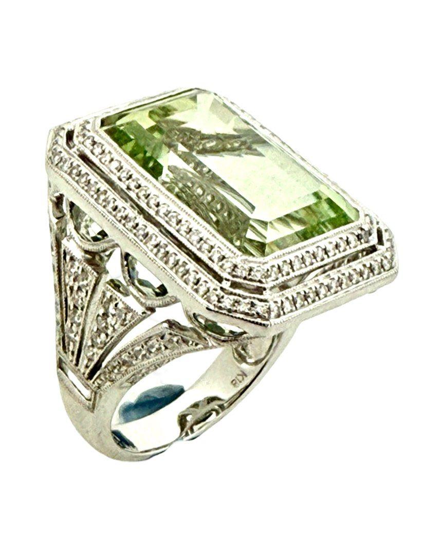 Beautiful Green Granet Diamond Ring
Green Garnet1 16.87 ct 
Diamond 1.23 cts
Total weight: 16.38 grams