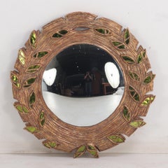 Green glass and resin convex mirror.
