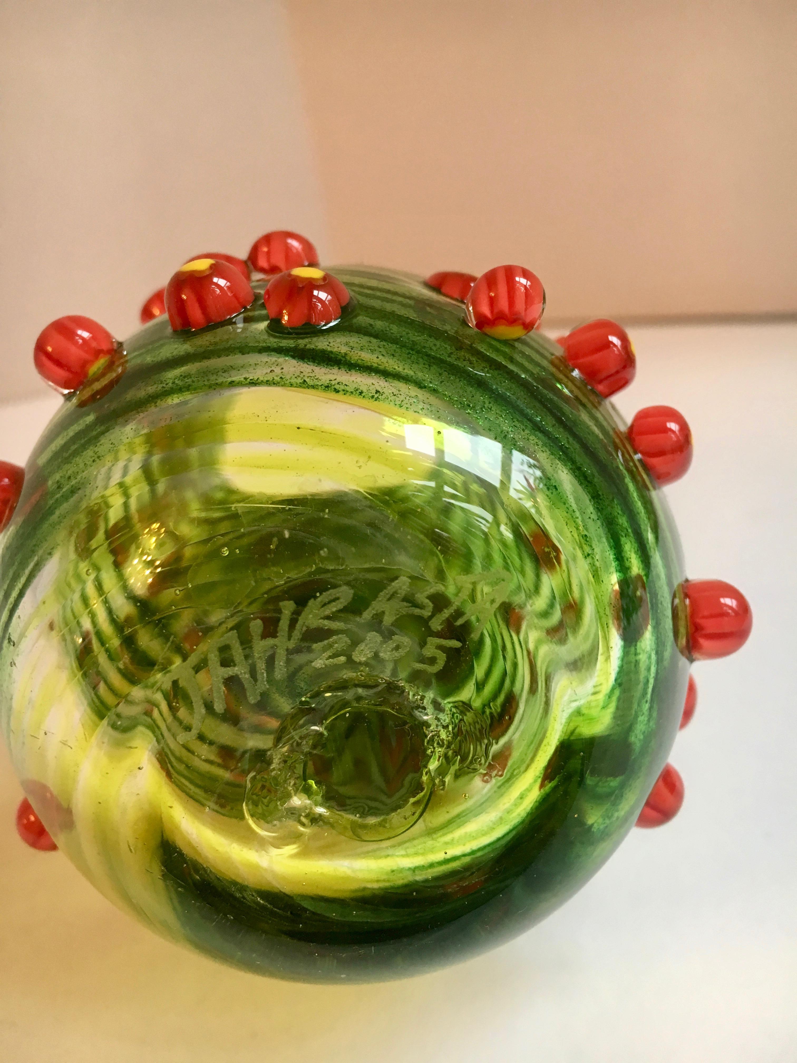 Green glass art vase. Signed by the artist, a small piece, well suited for the desk or addition to a shelf or guest room, a special piece that works well with flowers, however is a handsome stand-alone piece of art.  similar to Murano Italy