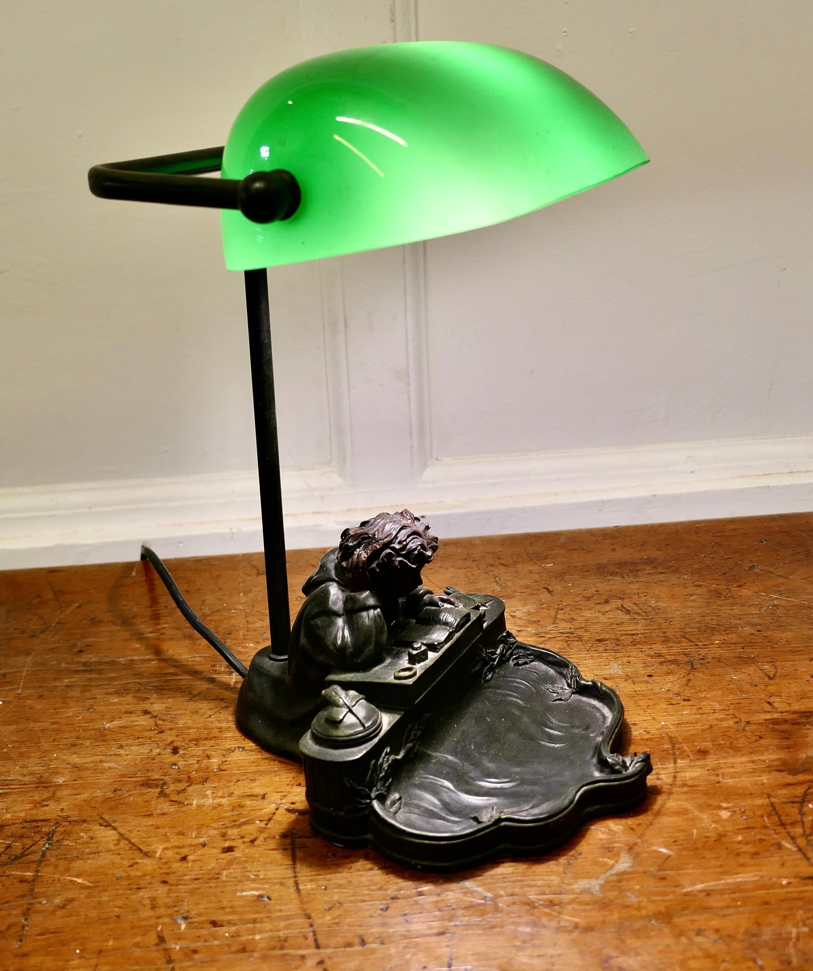 Green Glass Banker’s Desk Lamp  

A beautiful and seldom seen heavy quality fully adjustable vintage desk lamp, the Base is has a bronze finish and shows a young man studying at his desk with pens, inkwell and books, the book at the side has IRVINE