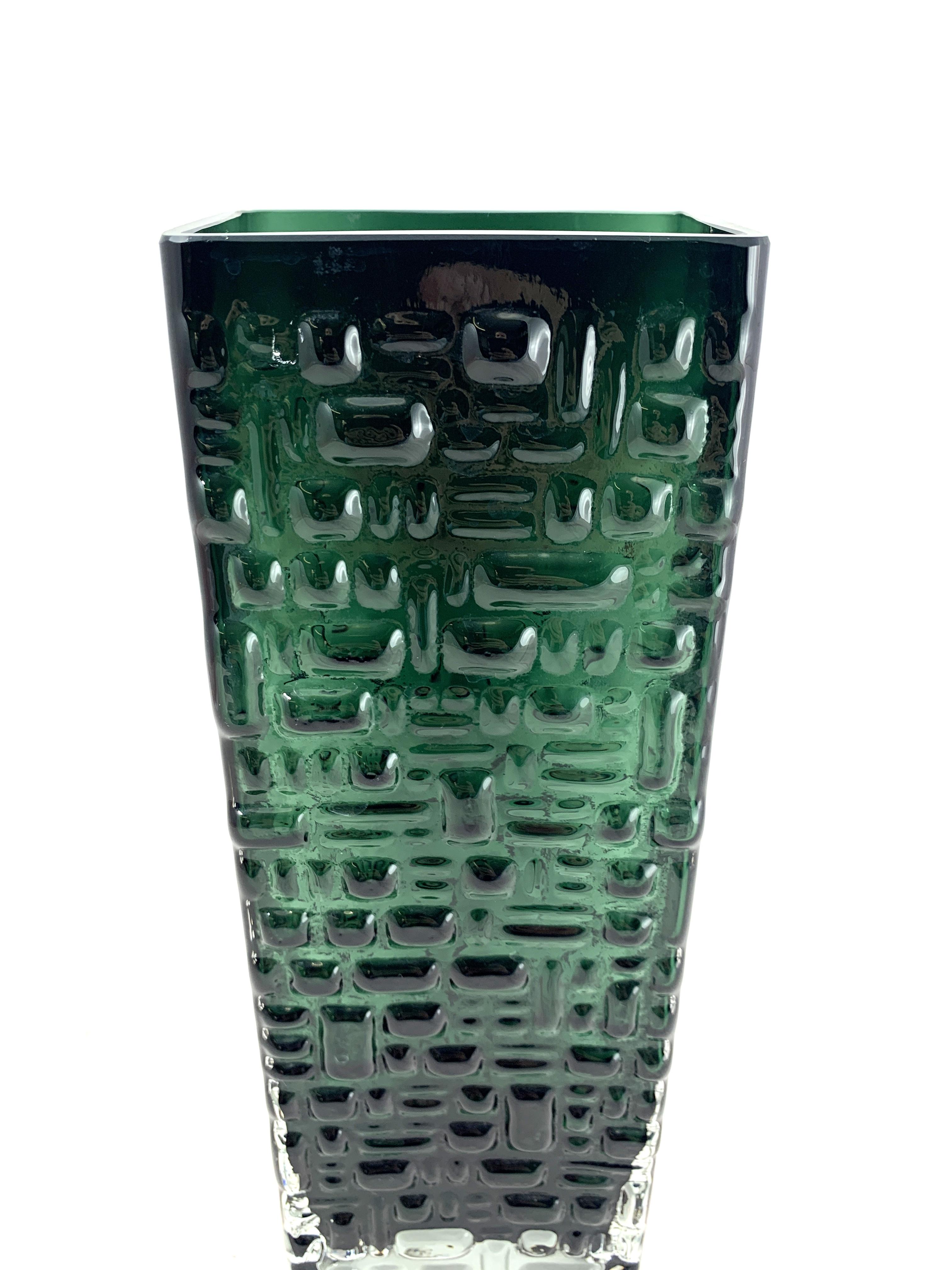Wonderful Mid-Century Modern German emerald green glass vase with geometric relief pattern by Gral Glass, designed by Emil Funke, circa 1970.