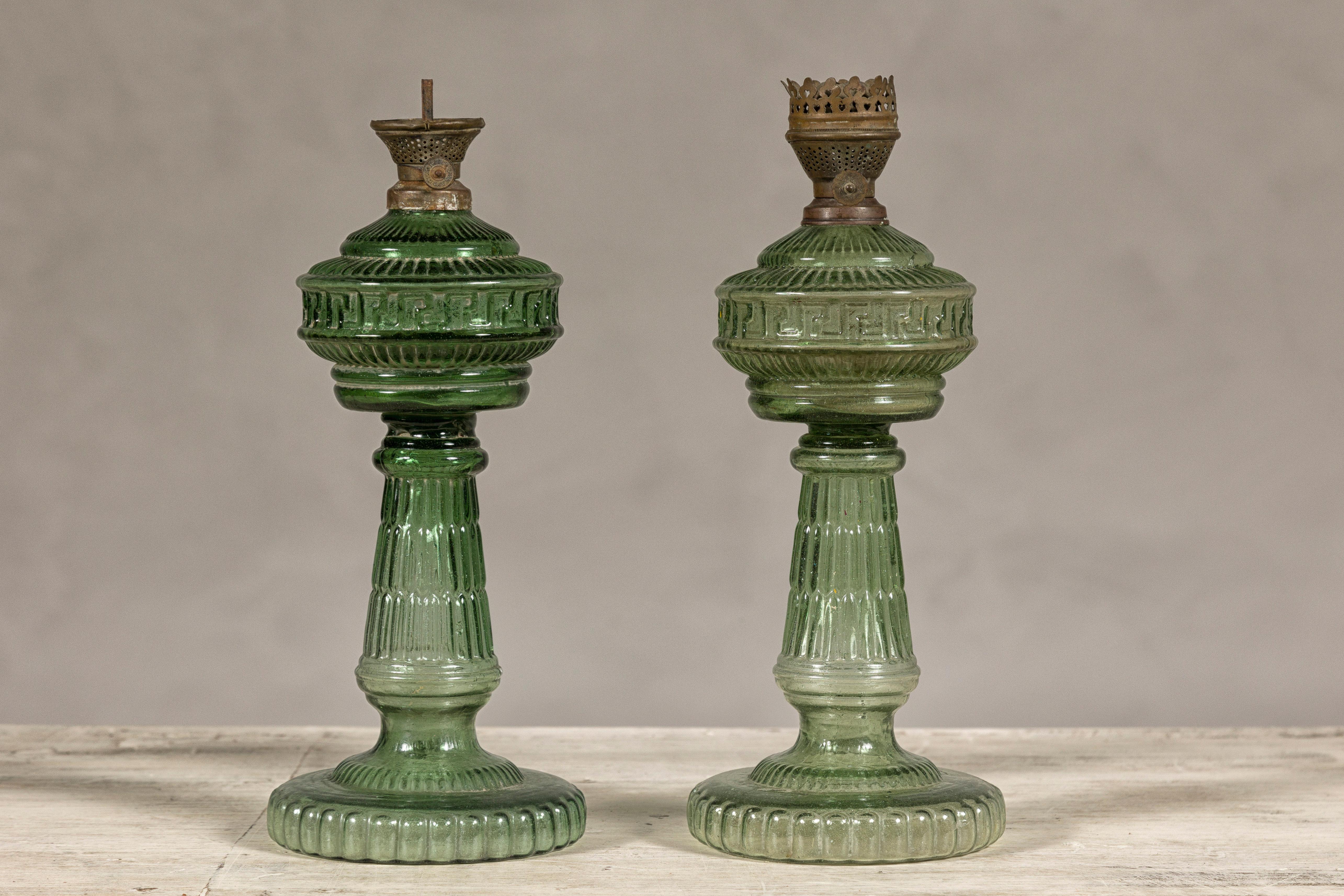 20th Century Green Glass Gas Lights with Meander Friezes, a Vintage Near Pair For Sale